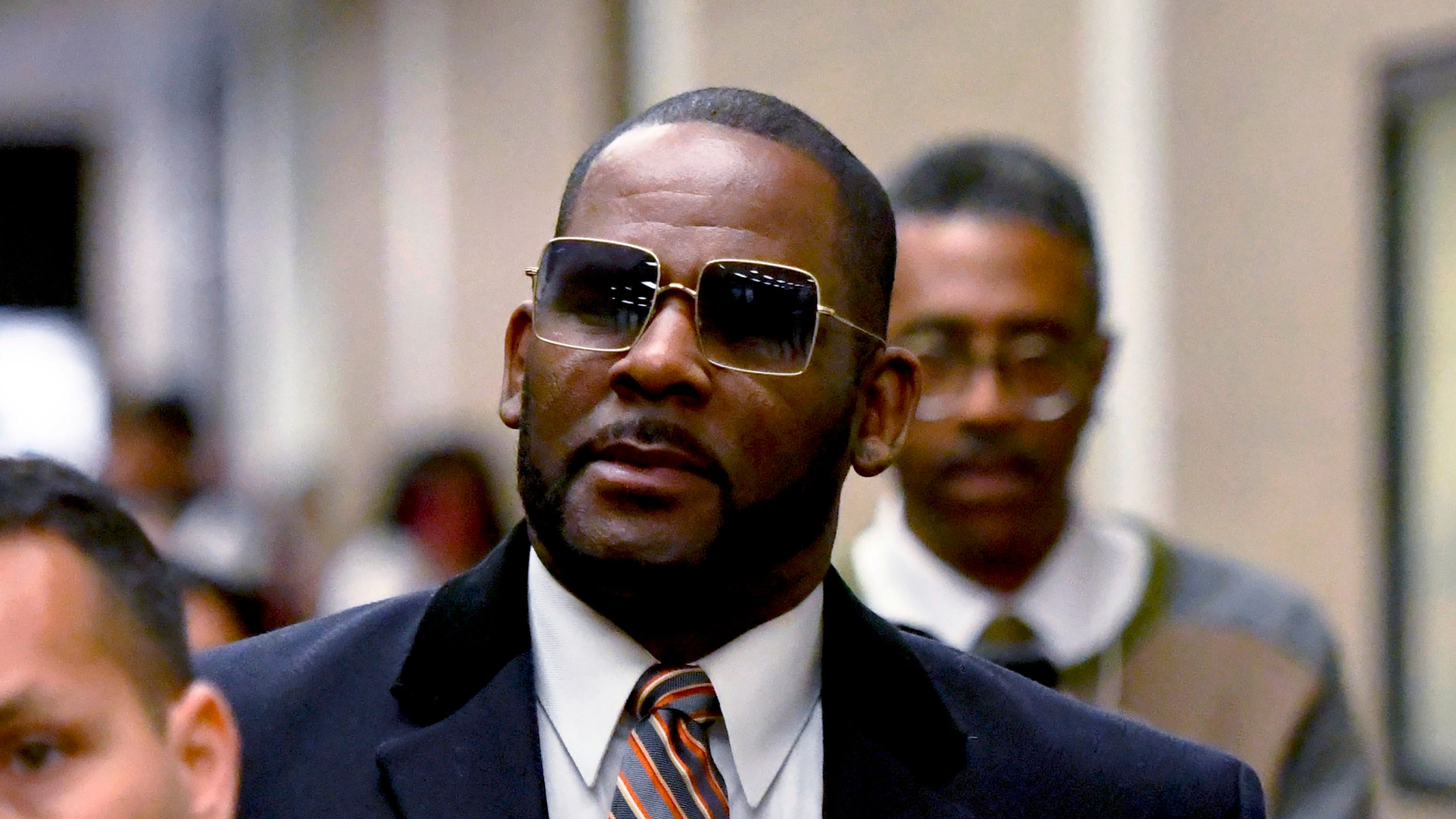 FILE - R. Kelly leaves the Daley Center after a hearing in his child support case, May 8, 2019, in Chicago. R. Kelly’s lawyer told an appeals court Monday, March 18, 2024, that all kinds of legitimate organizations — even college fraternities — could be deemed racketeering organizations under a law unjustly used to convict the R&B superstar at his Brooklyn trial of sexually abusing young fans, including some who were children, for decades. (AP Photo/Matt Marton, File)