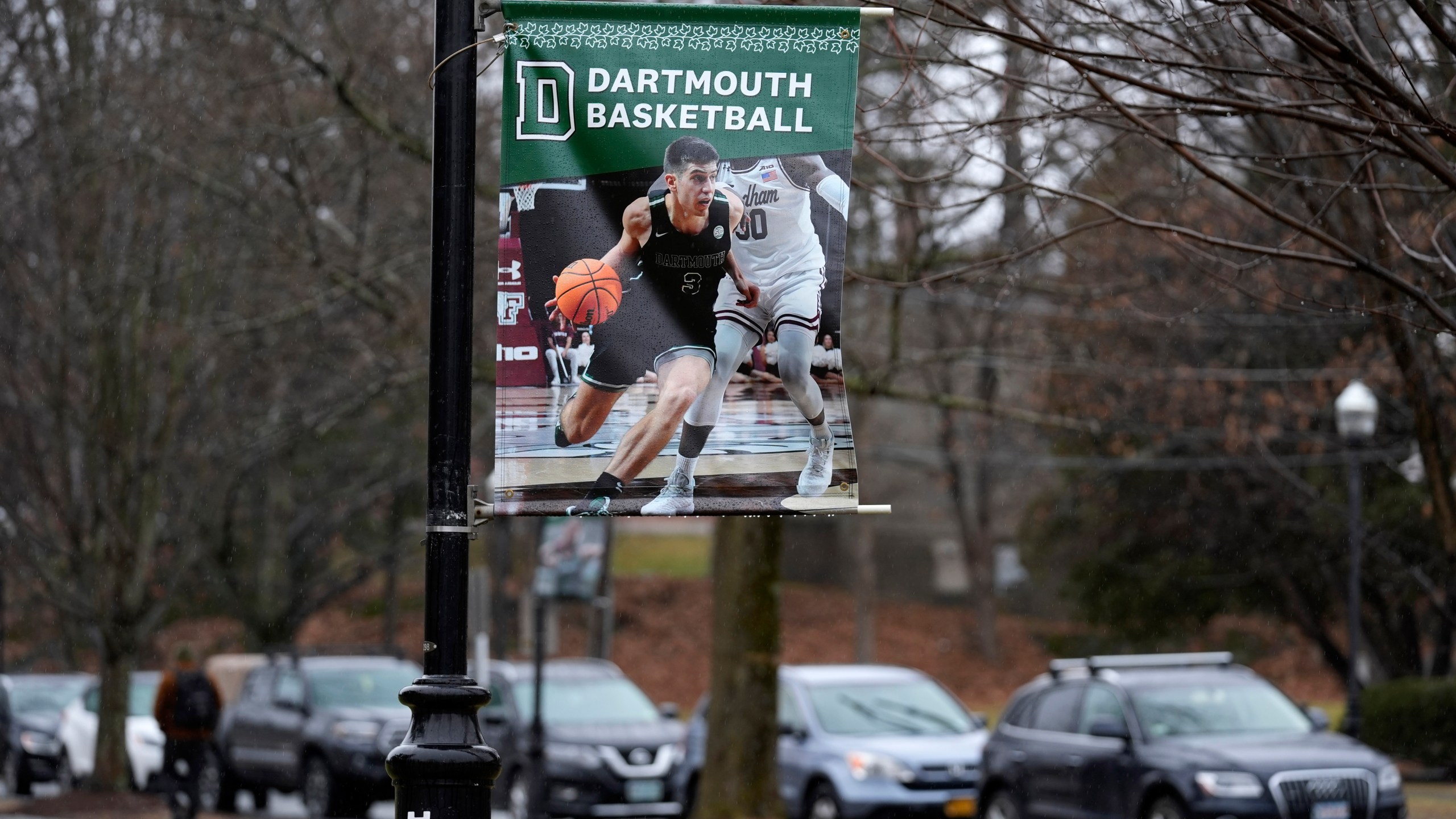 A poster of a basketball player is attached to a lamppost on the campus of Dartmouth College, Tuesday, March 5, 2024, in Hanover, N.H. Dartmouth basketball players voted to form a union, an unprecedented step in the continued deterioration of the NCAA's amateur business model. (AP Photo/Robert F. Bukaty)