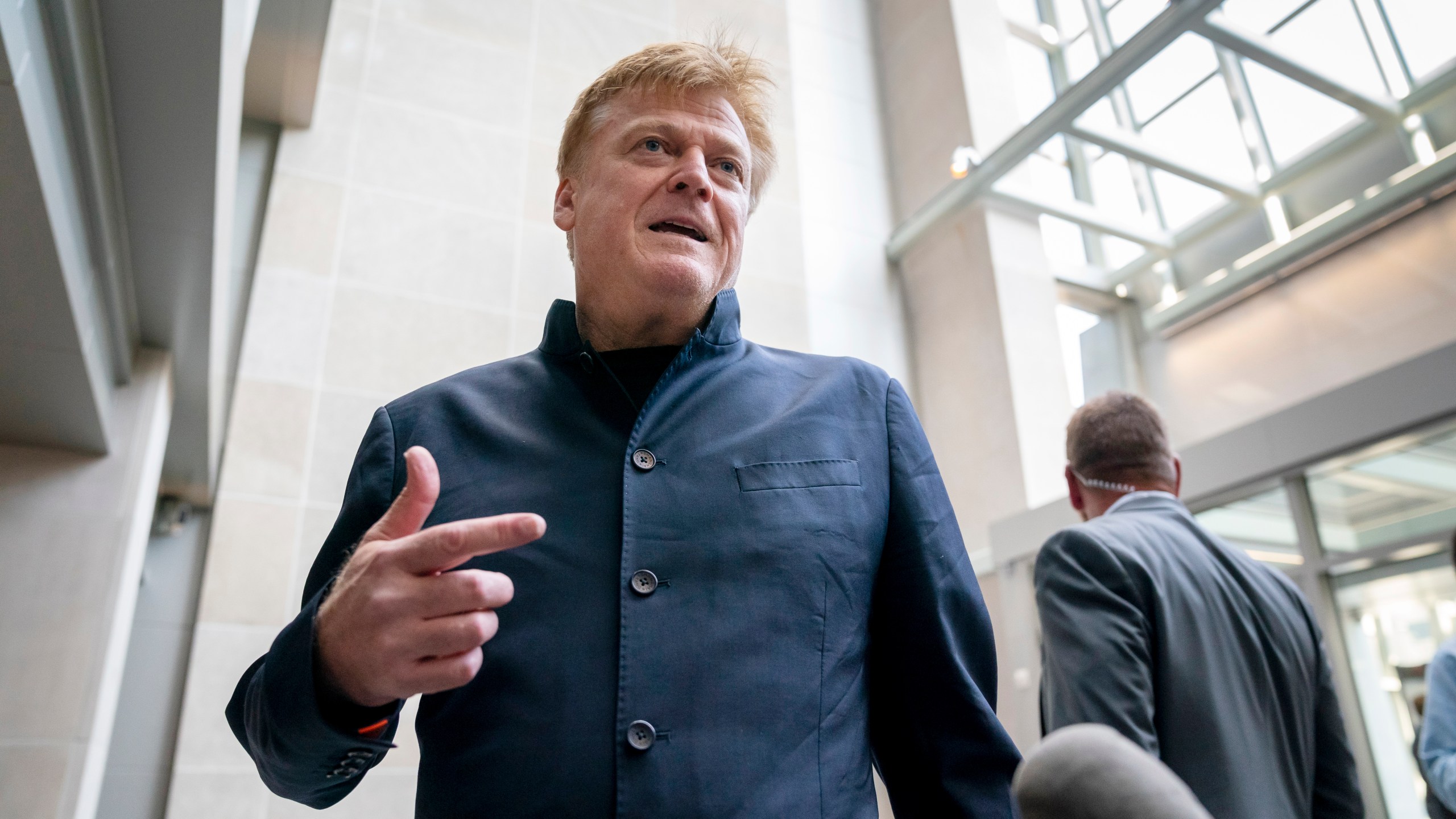 FILE - Patrick Byrne, the former chief executive of Overstock.com arrives at the O'Neill House Office Building on Capitol Hill in Washington, July 15, 2022. An attorney charged with illegally accessing Michigan voting machines after the 2020 election acknowledged in a court filing Monday, March 18, 2024, that she disseminated numerous confidential emails from a voting machine company in a separate case. Lambert had just joined the Dominion defamation case to represent Byrne. (AP Photo/J. Scott Applewhite, File)