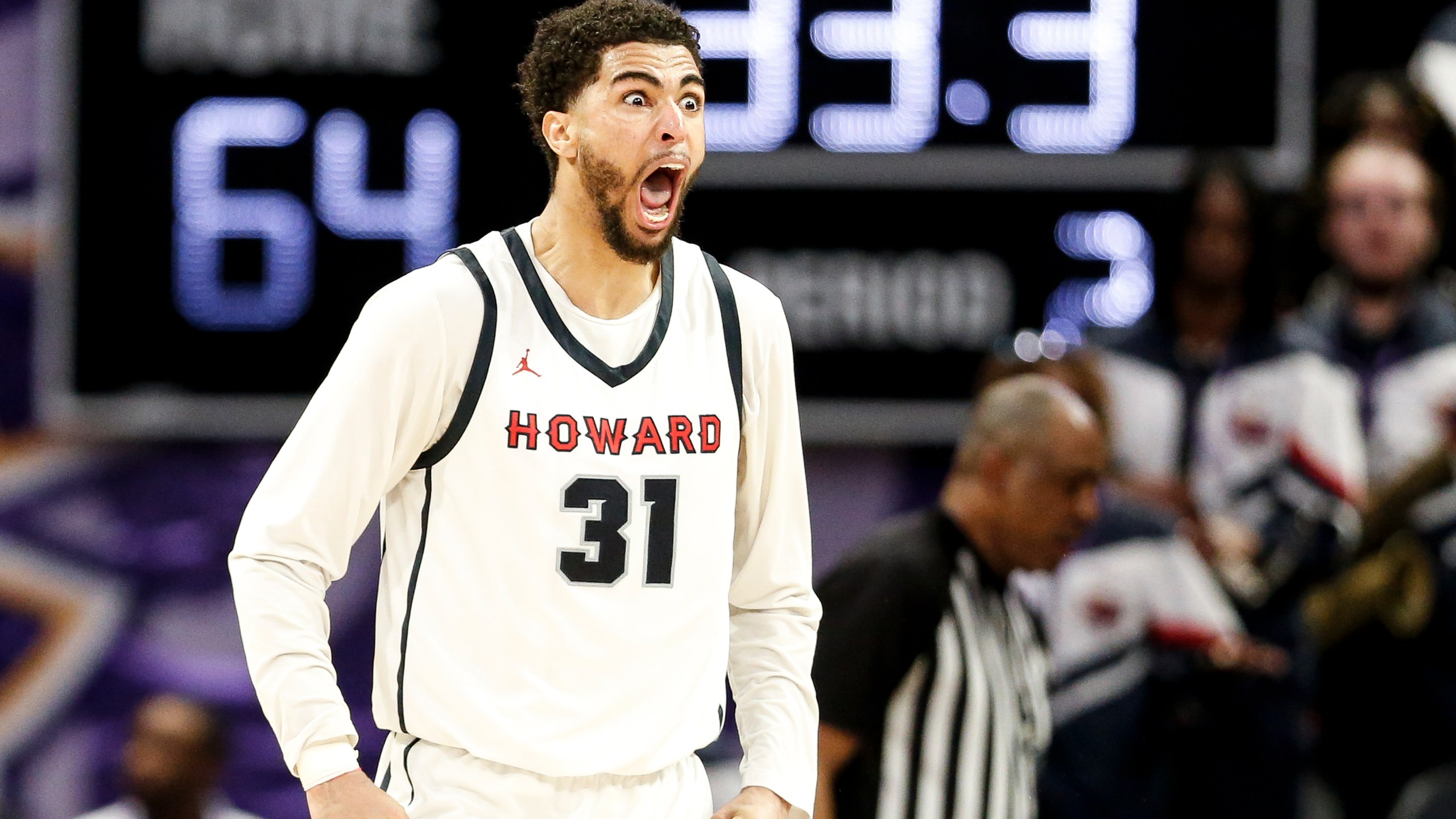 Howard Seth Towns (31) reacts to a foul against Delaware State with less than a minute left in the game. Howard defeated Delaware State 70-67 in the Mid-Eastern Athletic Conference tournament in Norfolk, Va., on Saturday, March 16, 2024. (Billy Schuerman/The Virginian-Pilot via AP)