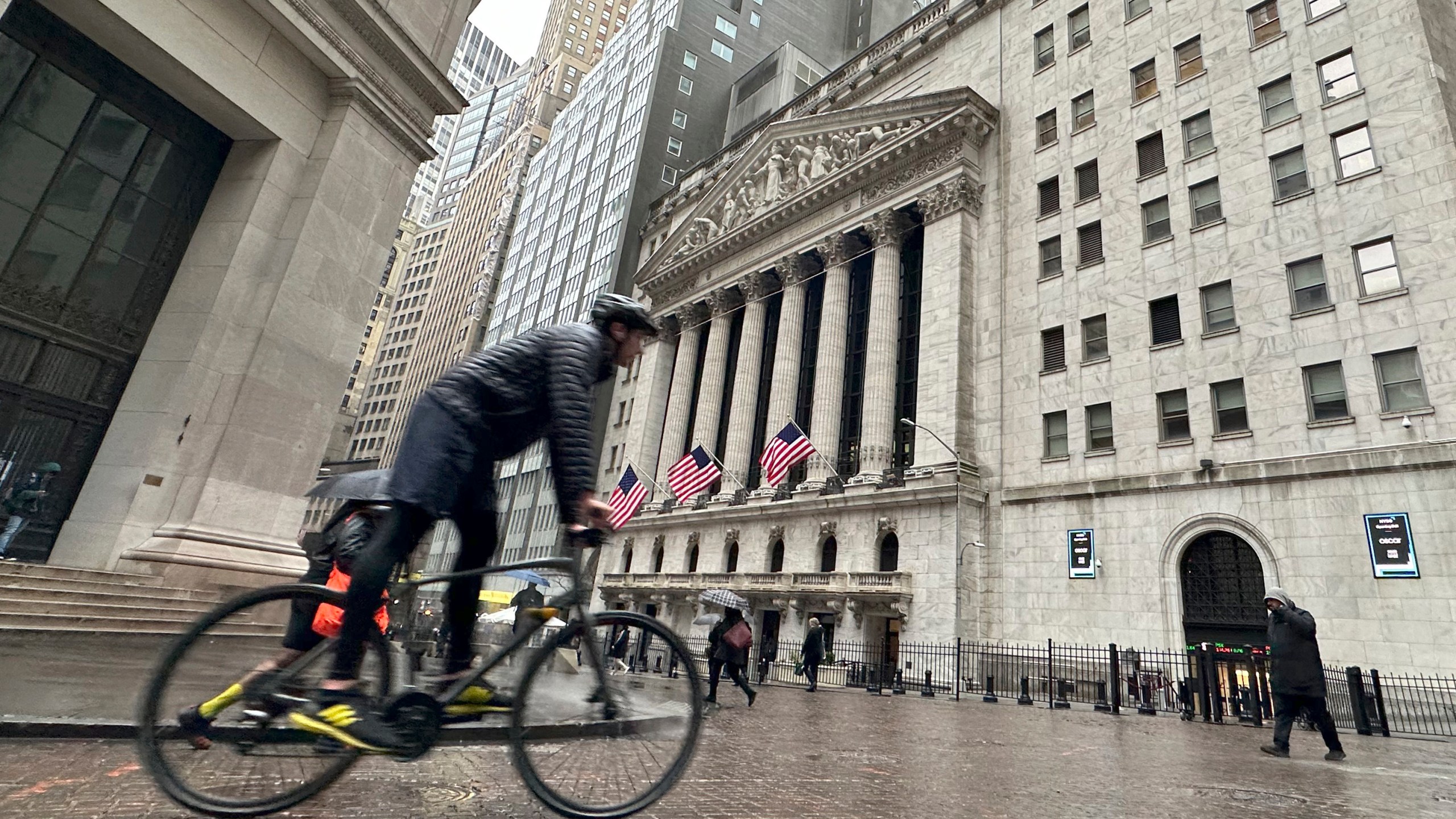 CORRECTS TO 1.1% HIGHER STED OF TK% HIGHER FILE - A bicyclist passes the New York Stock Exchange on March 5, 2024, in New York. Stocks are rising Monday, March 18, 2024 ahead of a busy week for central banks around the world that could dictate where interest rates go. The S&P 500 was 1.1% higher in early trading, coming off its first back-to-back weekly loss since October. (AP Photo/Peter Morgan, file)