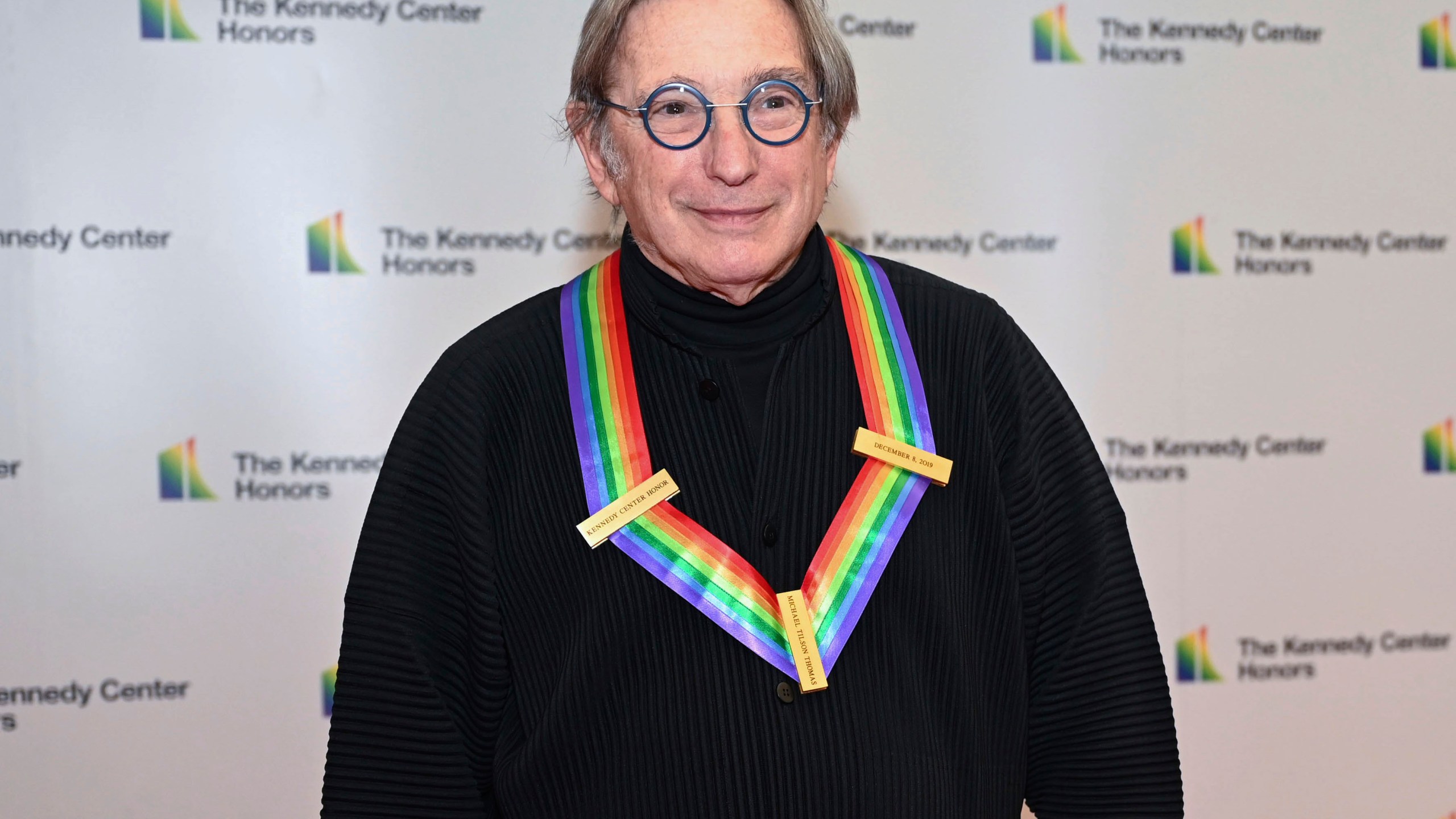 FILE - Conductor Michael Tilson Thomas arrives at the State Department for the Kennedy Center Honors gala dinner, Saturday, Dec. 3, 2022, in Washington. Tilson Thomas, an honoree in 2019, is to conduct the opening subscription program of the New York Philharmonic season. (AP Photo/Kevin Wolf, File)