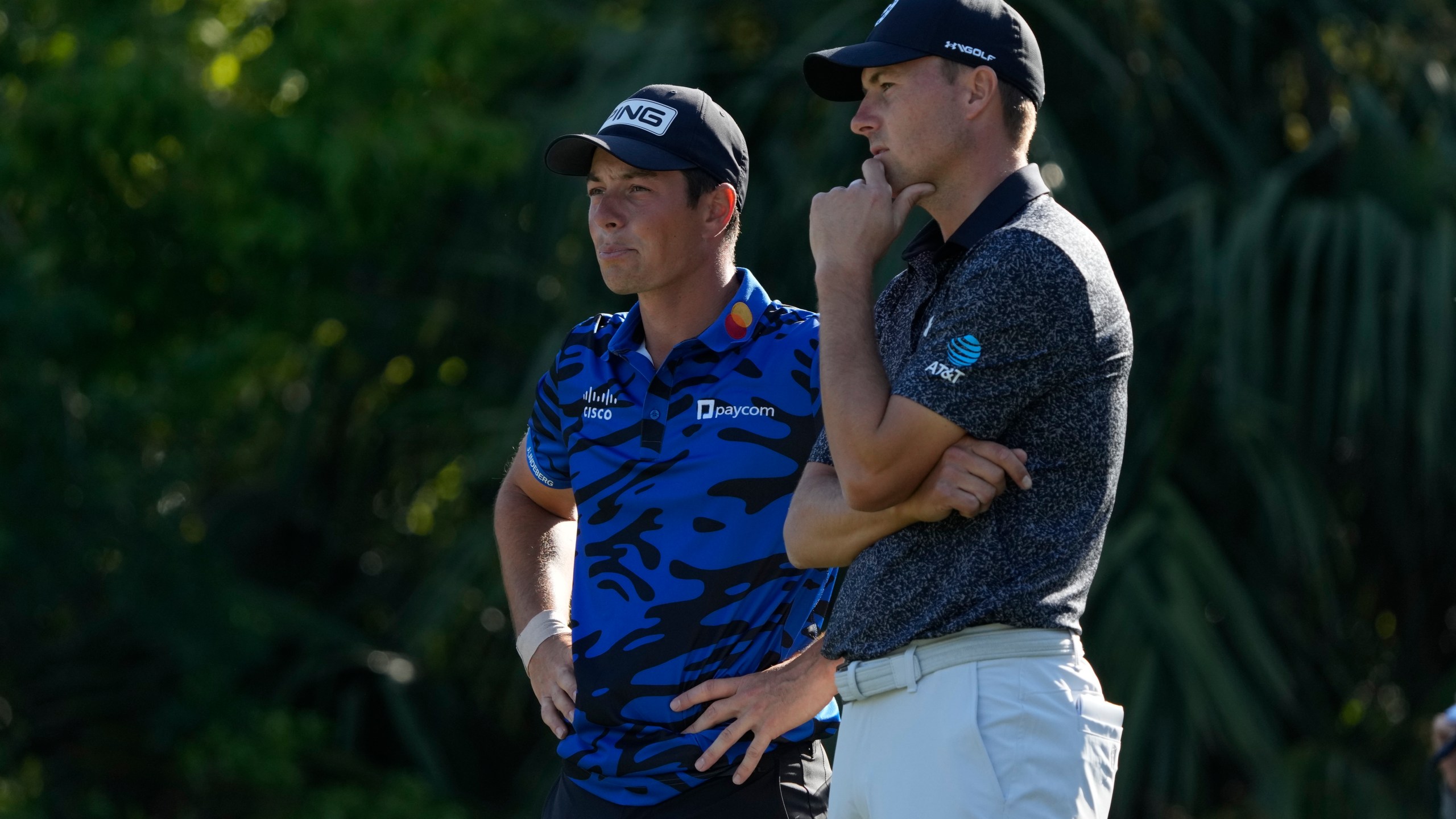 Viktor Hovland, of Norway, left, and Jordan Spieth wait to putt on the 14th green during the first round of The Players Championship golf tournament Thursday, March 14, 2024, in Ponte Vedra Beach, Fla. (AP Photo/Lynne Sladky)