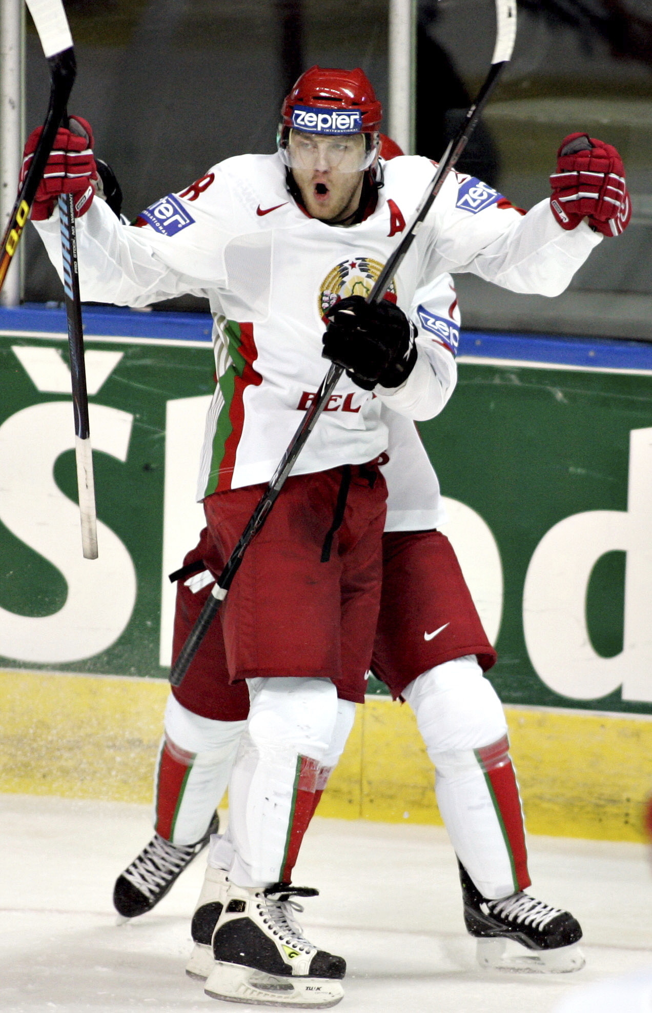 FILE - Belarus forward Konstantin Koltsov, front, and defenseman Vladimir Denisov celebrates Belarus's first goal against Switzerland during second period action at the IIHF world hockey championship Monday May 5, 2008, in Quebec City. Retired Belarusian hockey player-turned-coach Konstantin Koltsov has died. He was 42. Miami-Dade Police detective Argemis Colome confirmed Koltsov's death in a statement sent to The Associated Press Tuesday, March 19, 2024. (Francis Vachon/Canadian Presss via AP)