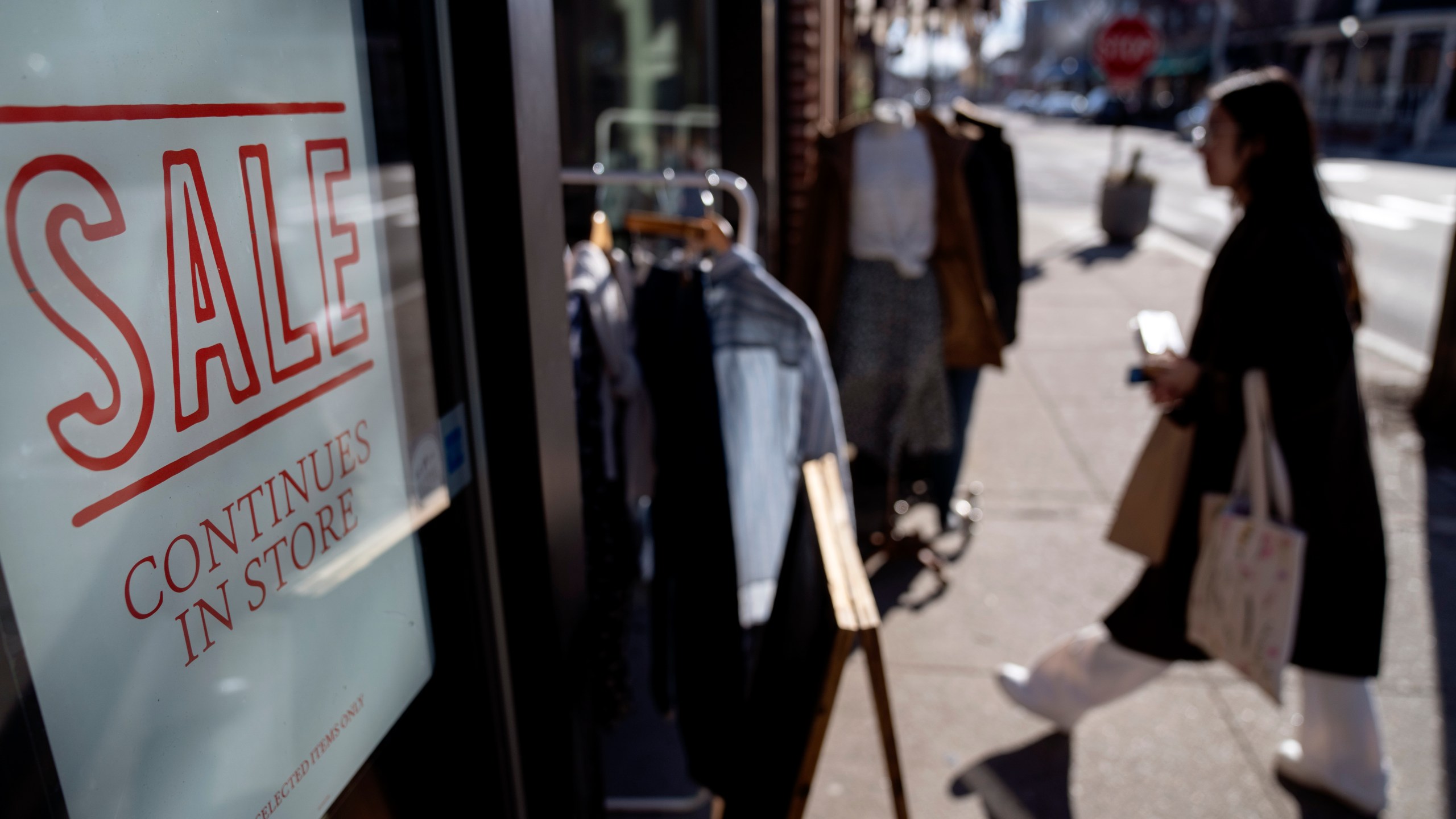FILE - A shop holds a sidewalk sale on Feb. 10, 2023, in Providence, R.I. Inflation remains a top concern for small businesses, which reported lower optimism in February. (AP Photo/David Goldman, File)