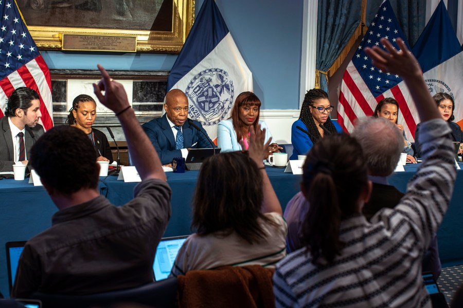 New York City Mayor Eric Adams, third left, listens to questions from the media during a news conference at City Hall in New York, Tuesday, March 19, 2024. (AP Photo/Eduardo Munoz Alvarez)