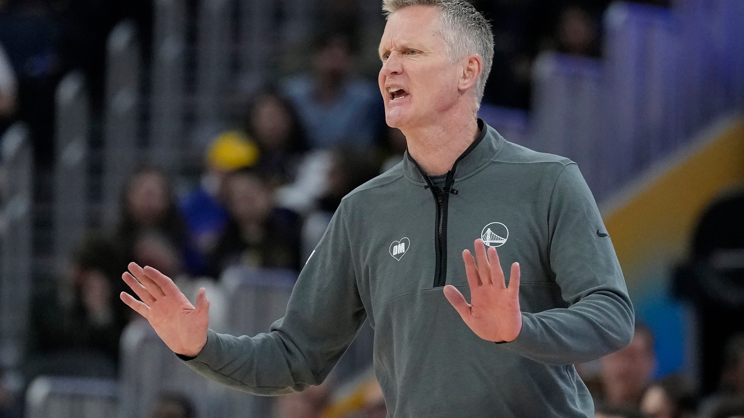 Golden State Warriors head coach Steve Kerr gestures toward players during the first half of the team's NBA basketball game against the New York Knicks in San Francisco, Monday, March 18, 2024. (AP Photo/Jeff Chiu)