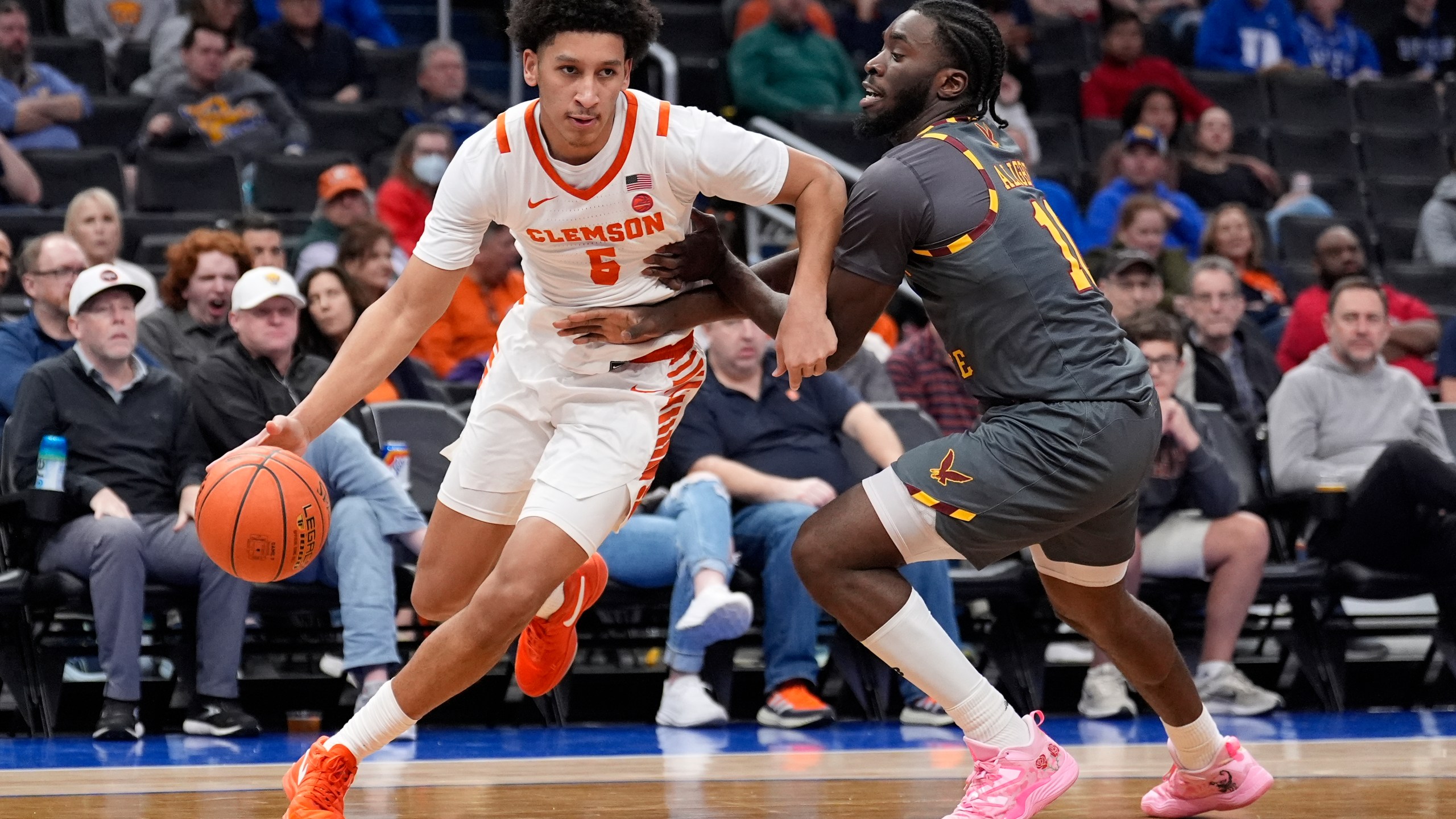 Clemson forward Jack Clark (5) driving around Boston College guard Prince Aligbe (10) during the second half of the Atlantic Coast Conference NCAA college basketball tournament Wednesday, March 13, 2024, in Washington. (AP Photo/Alex Brandon)