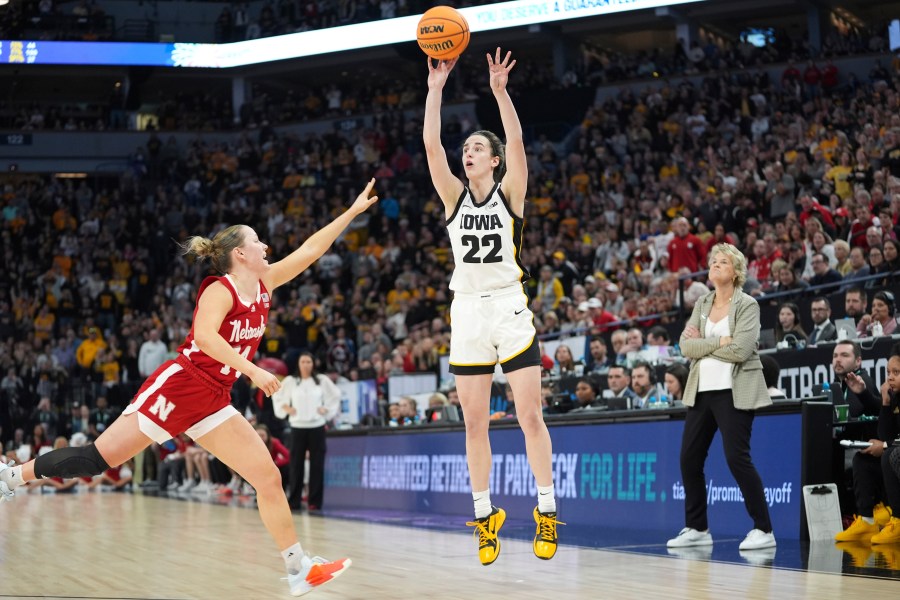 Iowa guard Caitlin Clark (22) shoots over Nebraska guard Callin Hake during overtime of an NCAA college basketball game in the final of the Big Ten women's tournament Sunday, March 10, 2024, in Minneapolis. (AP Photo/Abbie Parr)