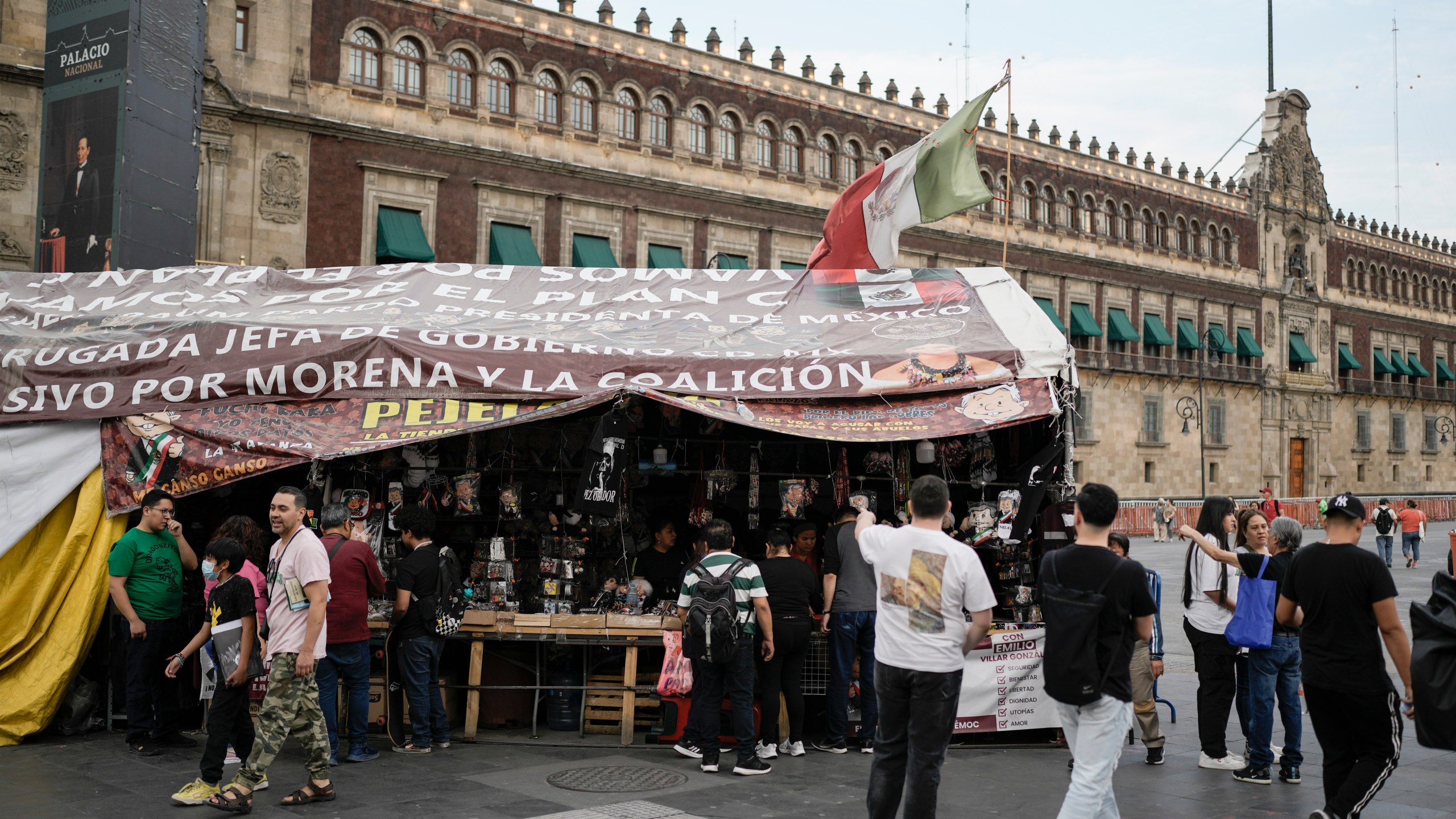 A stall stands outside the presidential palace, selling souvenirs of Mexican President Andrés Manuel López Obrador, in Mexico City, Friday, March 15, 2024. Despite not being eligible to run for reelection in the upcoming June 2 presidential vote, López Obrador looms larger than any of the candidates competing for the helm of Mexico’s government. (AP Photo/Eduardo Verdugo)