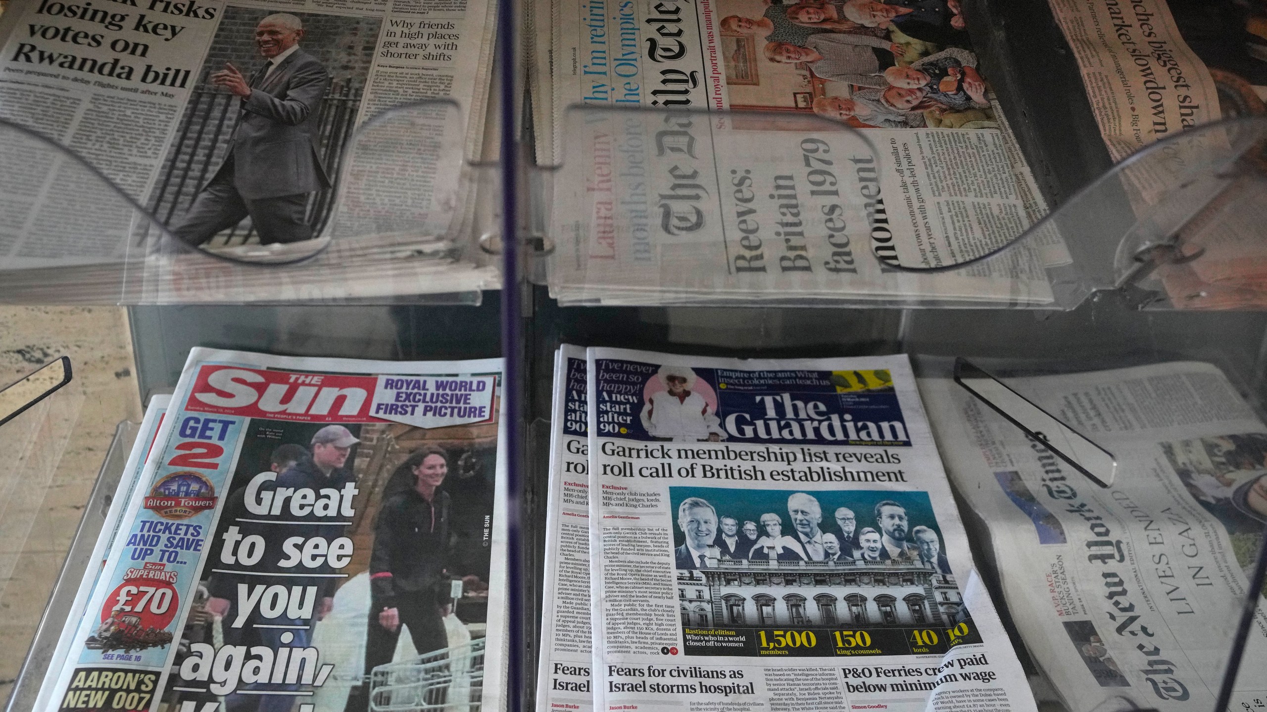 Newspapers on display for sale in London, Tuesday, March 19, 2024. A British newspaper says Prince William and his wife Catherine have been filmed at a farm shop near their Windsor home. It's the first reported footage of Kate since she had abdominal surgery for an unspecified condition two months ago. The Sun published a short clip late Monday that appeared to show the couple smiling as they walked together, carrying shopping bags. It said the footage was taken on Saturday. (AP Photo/Kirsty Wigglesworth)