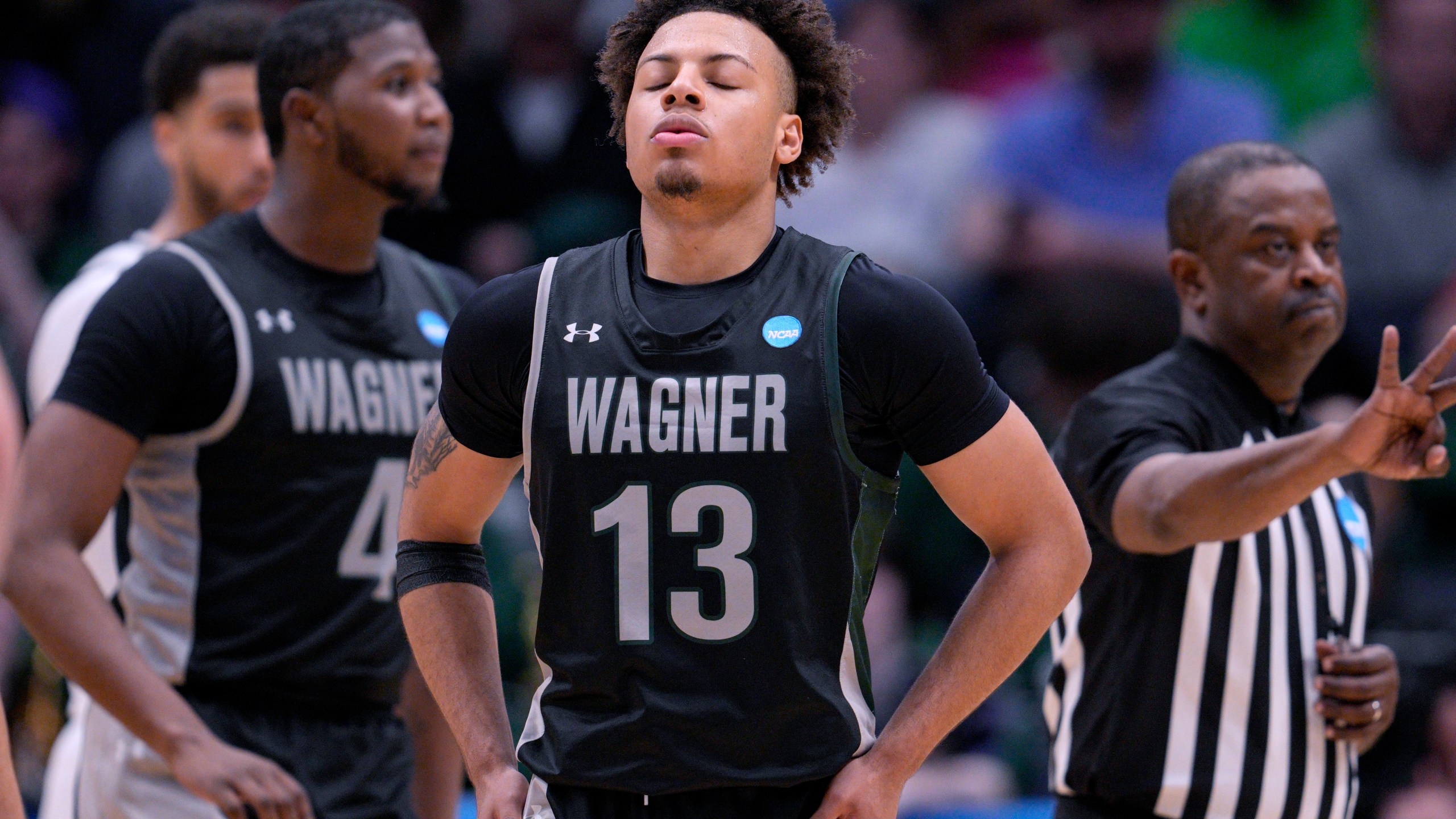 Wagner's Julian Brown (13) reacts prior to taking a free throw against Howard during the second half of a First Four college basketball game in the men's NCAA Tournament on Tuesday, March 19, 2024, in Dayton, Ohio. (AP Photo/Jeff Dean)