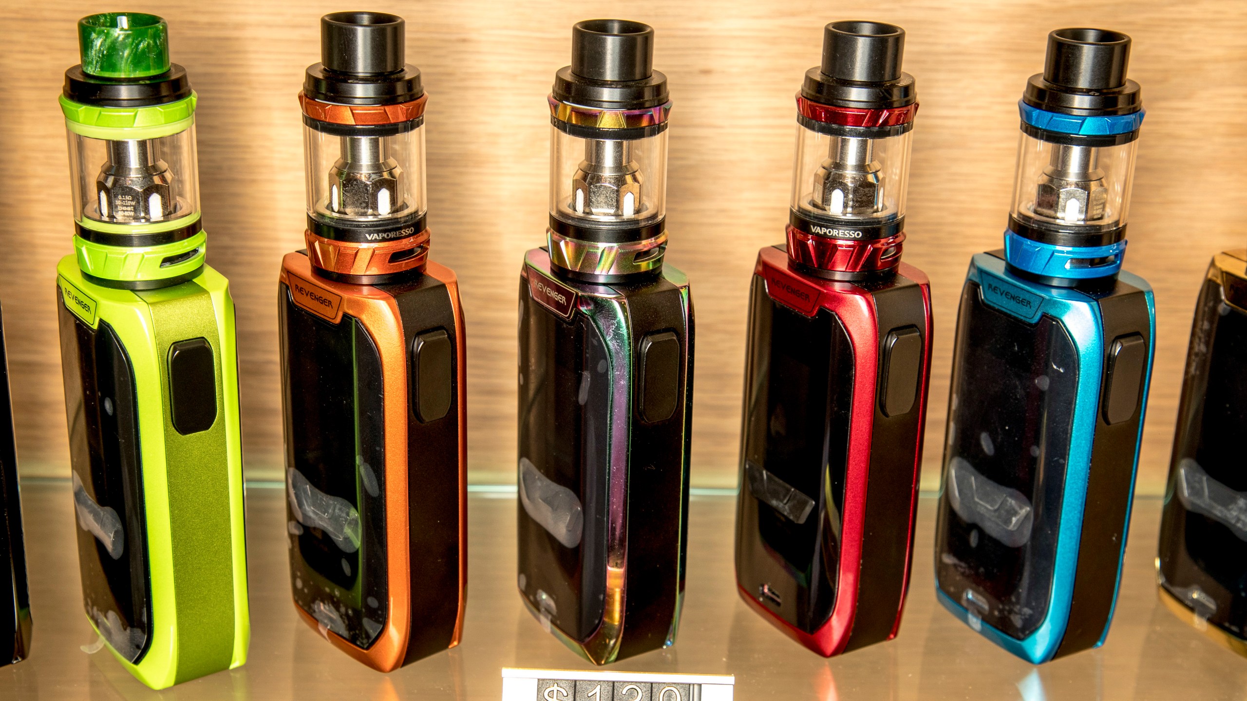 This shows a row of vapes in an Auckland store, on Feb. 11, 2018. The New Zealand Government said Wednesday, March 20, 2024, that it will ban disposable e-cigarettes, or vapes, and raise financial penalties for those who sell such products to minors. (Michael Craig/New Zealand Herald via AP)
