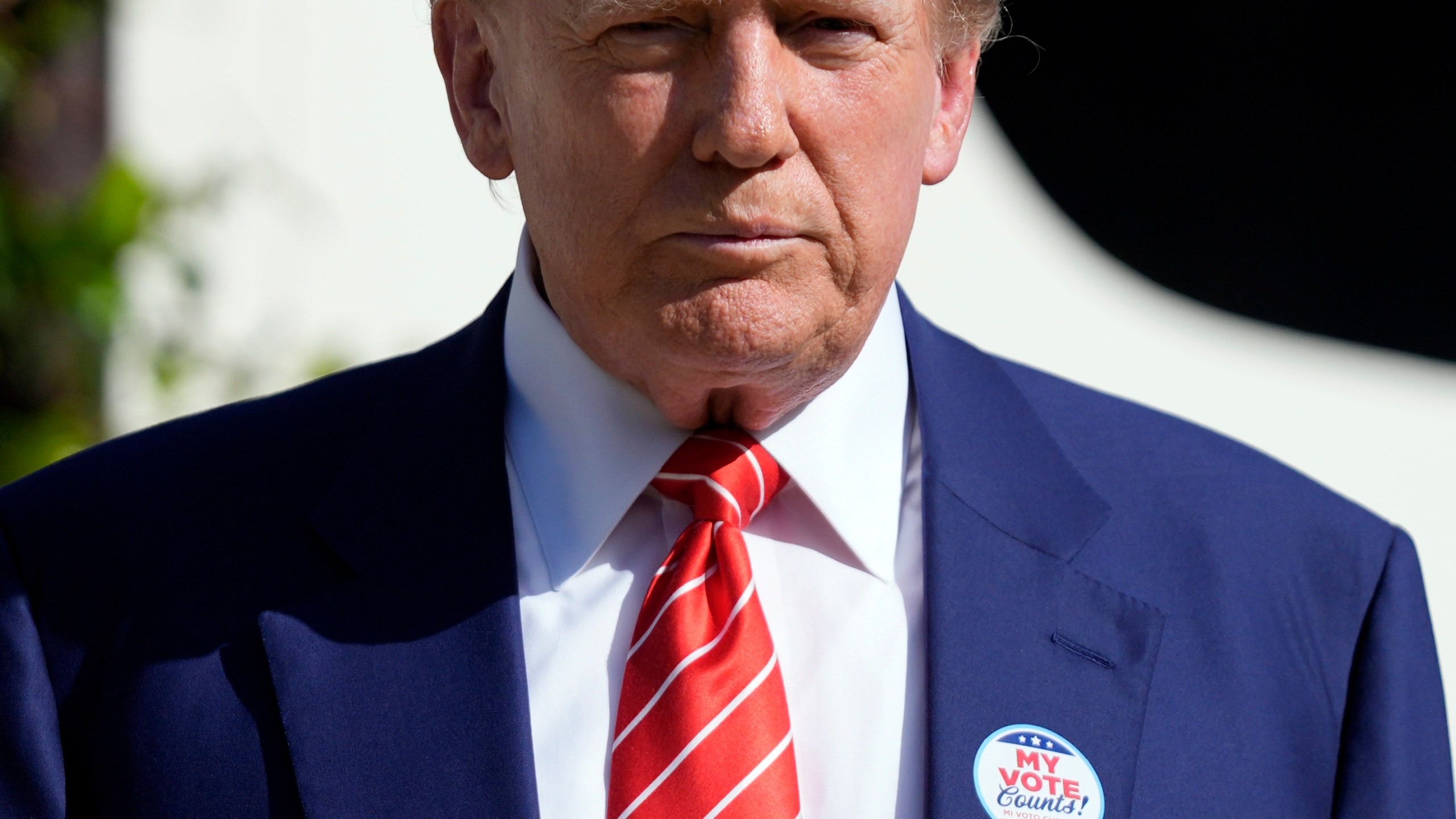 Republican presidential candidate former President Donald Trump listens to a question from a reporter after voting in the Florida primary election in Palm Beach, Fla., Tuesday, March 19, 2024. (AP Photo/Wilfredo Lee)