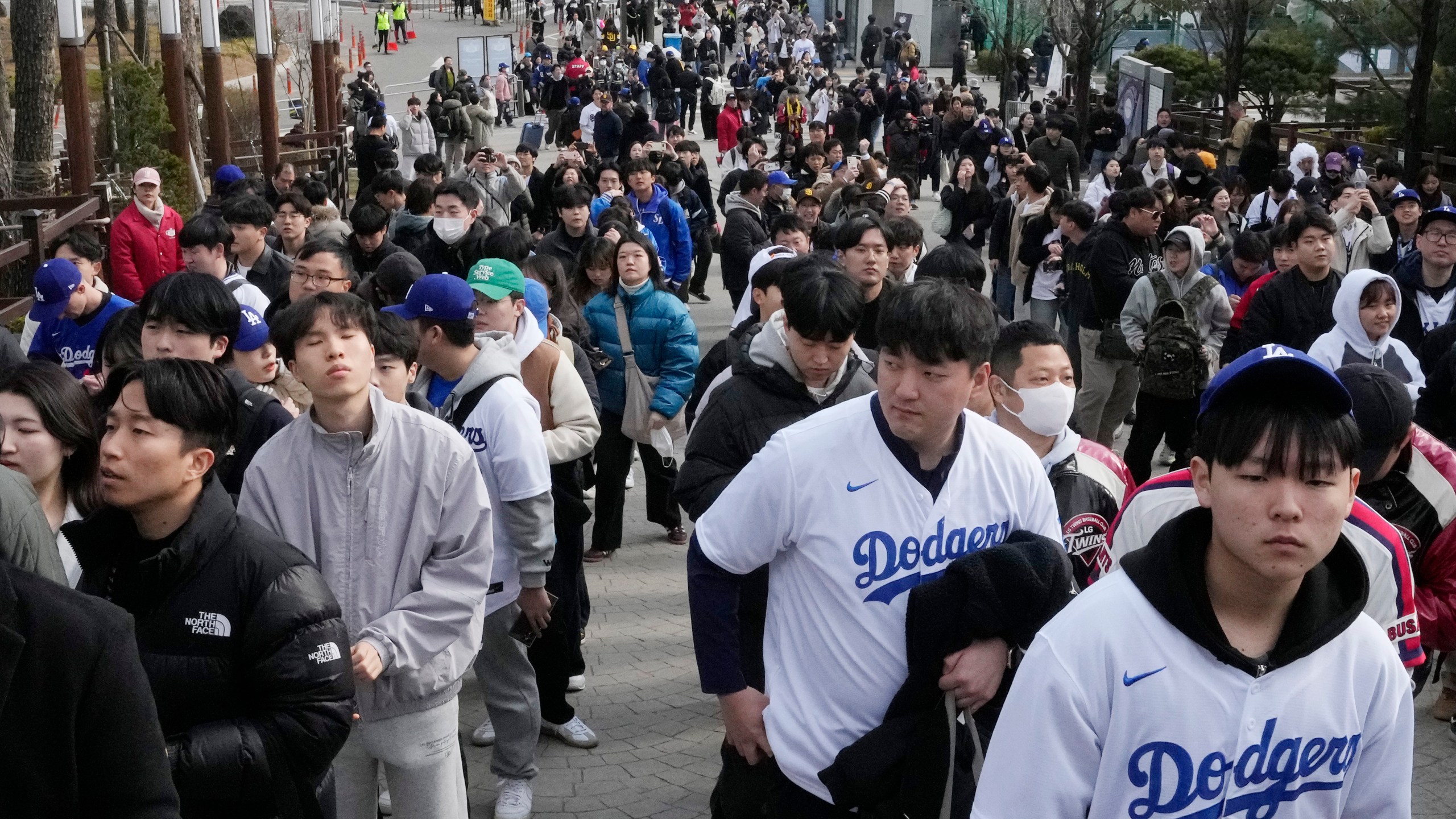 Fans make their way to the stadium prior to the 2024 Seoul Series game between Los Angeles Dodgers and San Diego Padres at Gocheok Sky Dom in Seoul, South Korea, Wednesday, March 20, 2024. (AP Photo/Ahn Young-joon)