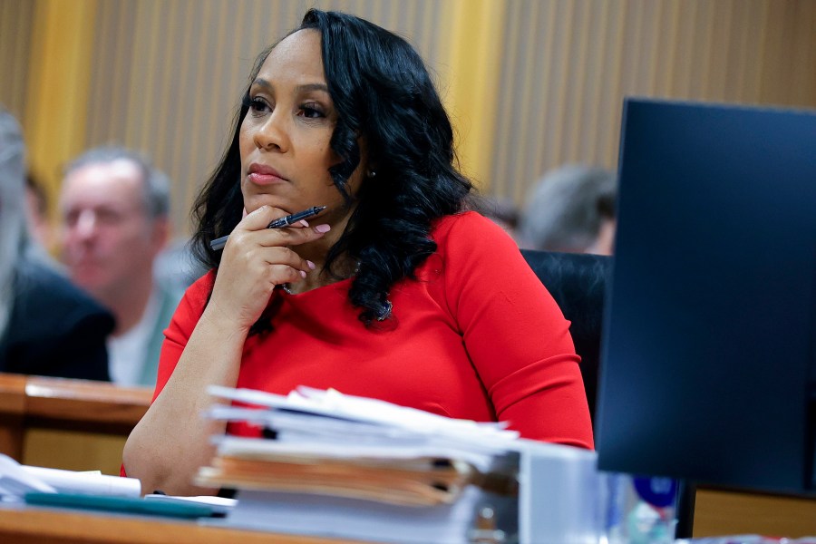 FILE - Fulton County District Attorney Fani Willis looks on during a hearing on the Georgia election interference case, Friday, March, 1, 2024, in Atlanta. An attorney for Donald Trump says he’s optimistic an appellate review will lead to the Georgia 2020 election interference case against him being dismissed and Fulton County District Attorney Fani Willis being disqualified. (AP Photo/Alex Slitz, Pool, File)