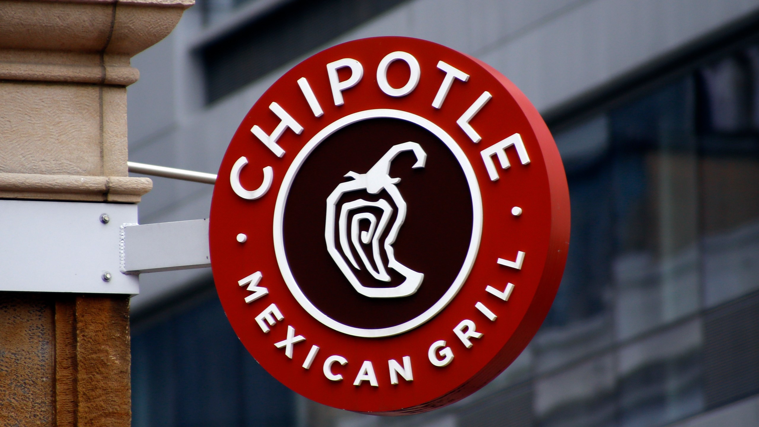 FILE - A sign for the Chipotle restaurant in Pittsburgh's Market Square is seen on Feb. 8, 2016. Chipotle Mexican Grill's board has approved a 50-for-1 stock split. In an announcement Tuesday, March 20, 2024, the burrito chain lauded the proposed split as one of the biggest in New York Stock Exchange history — while noting it believed the move would also boost accessibility of the company's stock. (AP Photo/Keith Srakocic, File)
