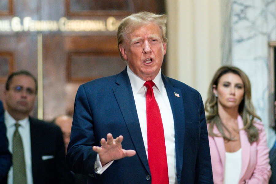 FILE - Former President Donald Trump speaks after exiting the courtroom for a break at New York Supreme Court, Dec. 7, 2023, in New York. New York State Lawyers urged an appeals court Wednesday, March 20, 2024, not to buy Trump's claims that he cannot find a way to post a bond fully covering a $454 million civil fraud judgment while he appeals. (AP Photo/Eduardo Munoz Alvarez, File)