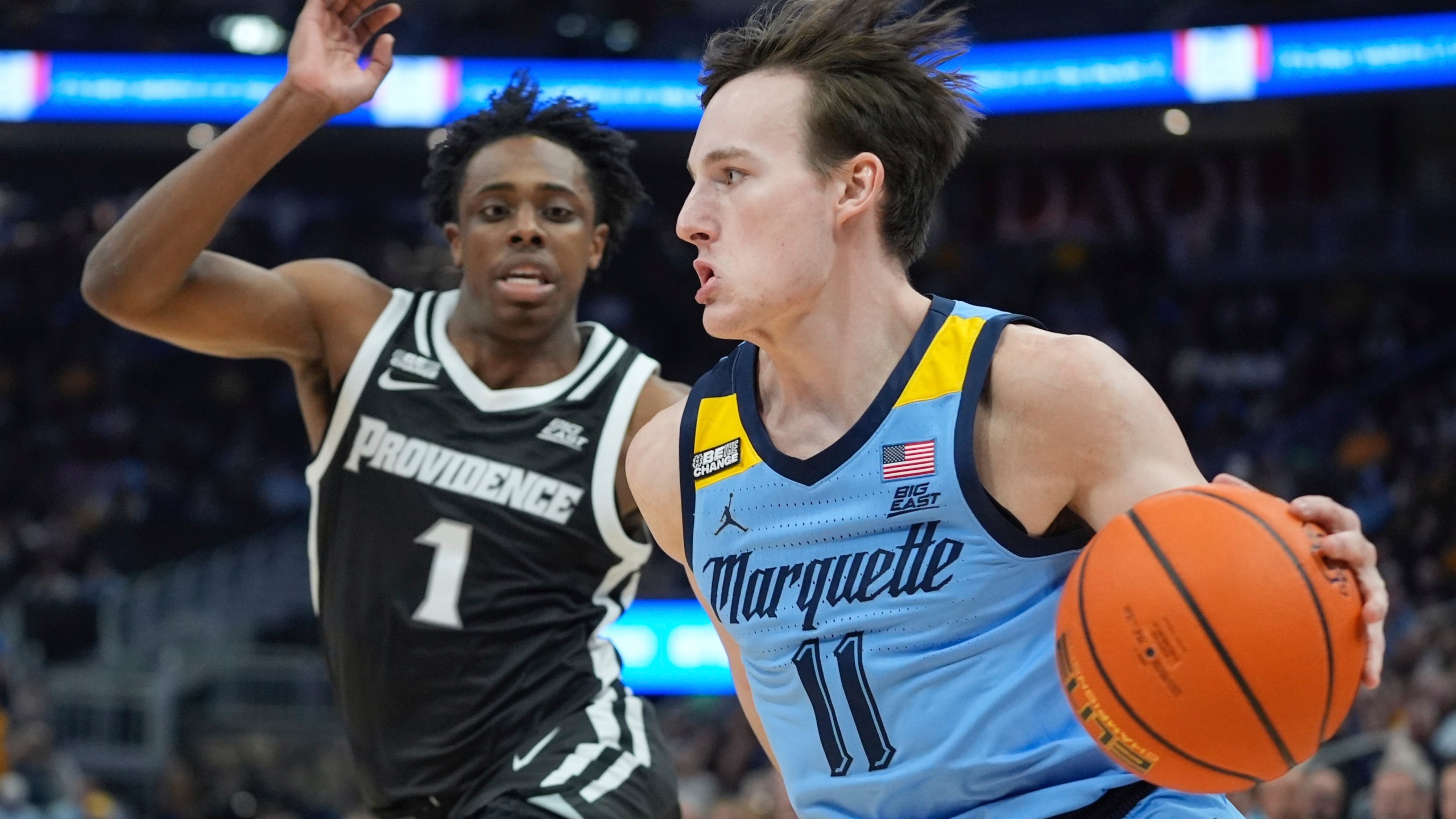 Marquette's Tyler Kolek drives past Providence's Jayden Pierre during the first half of an NCAA college basketball game Wednesday, Feb. 28, 2024, in Milwaukee. (AP Photo/Morry Gash)
