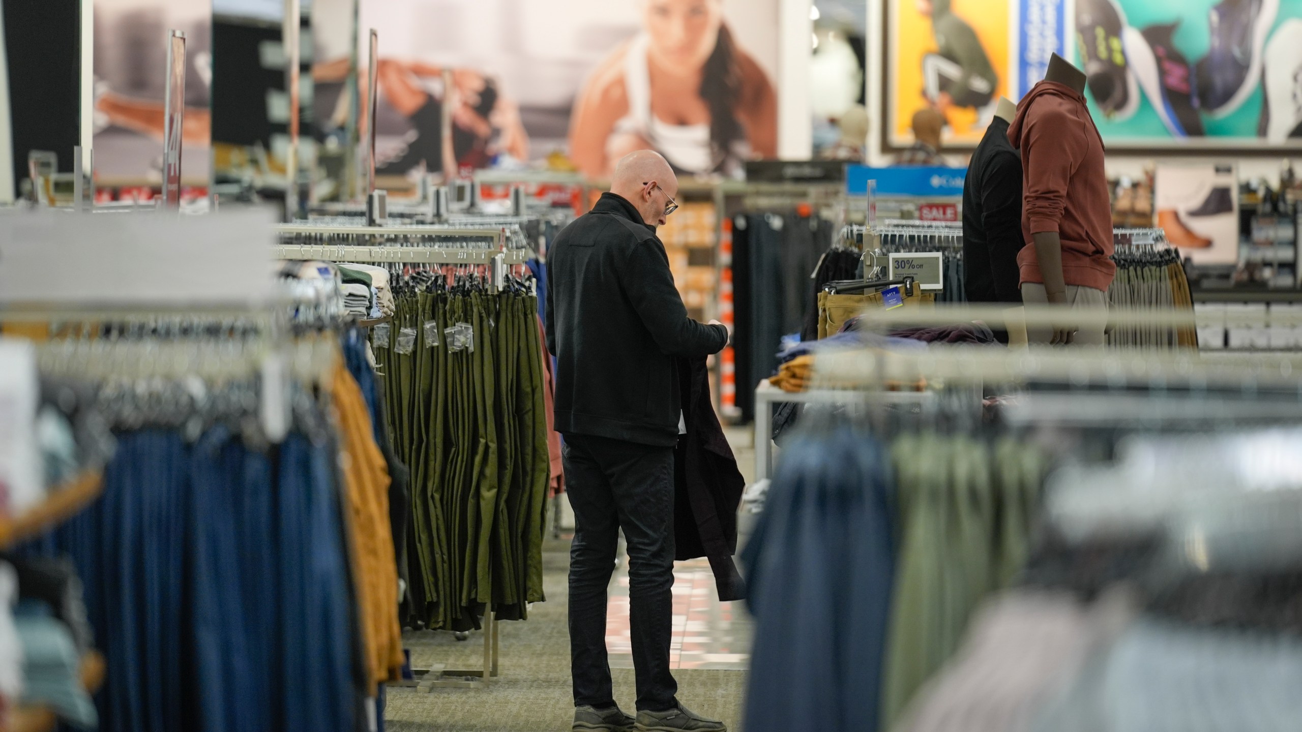 FILE - A shopper looks at clothing displayed at a Kohl's in Clifton, N.J., Jan. 26, 2024. On Tuesday, March 12, 2024, the Labor Department issues its report on inflation at the consumer level in February. (AP Photo/Seth Wenig)