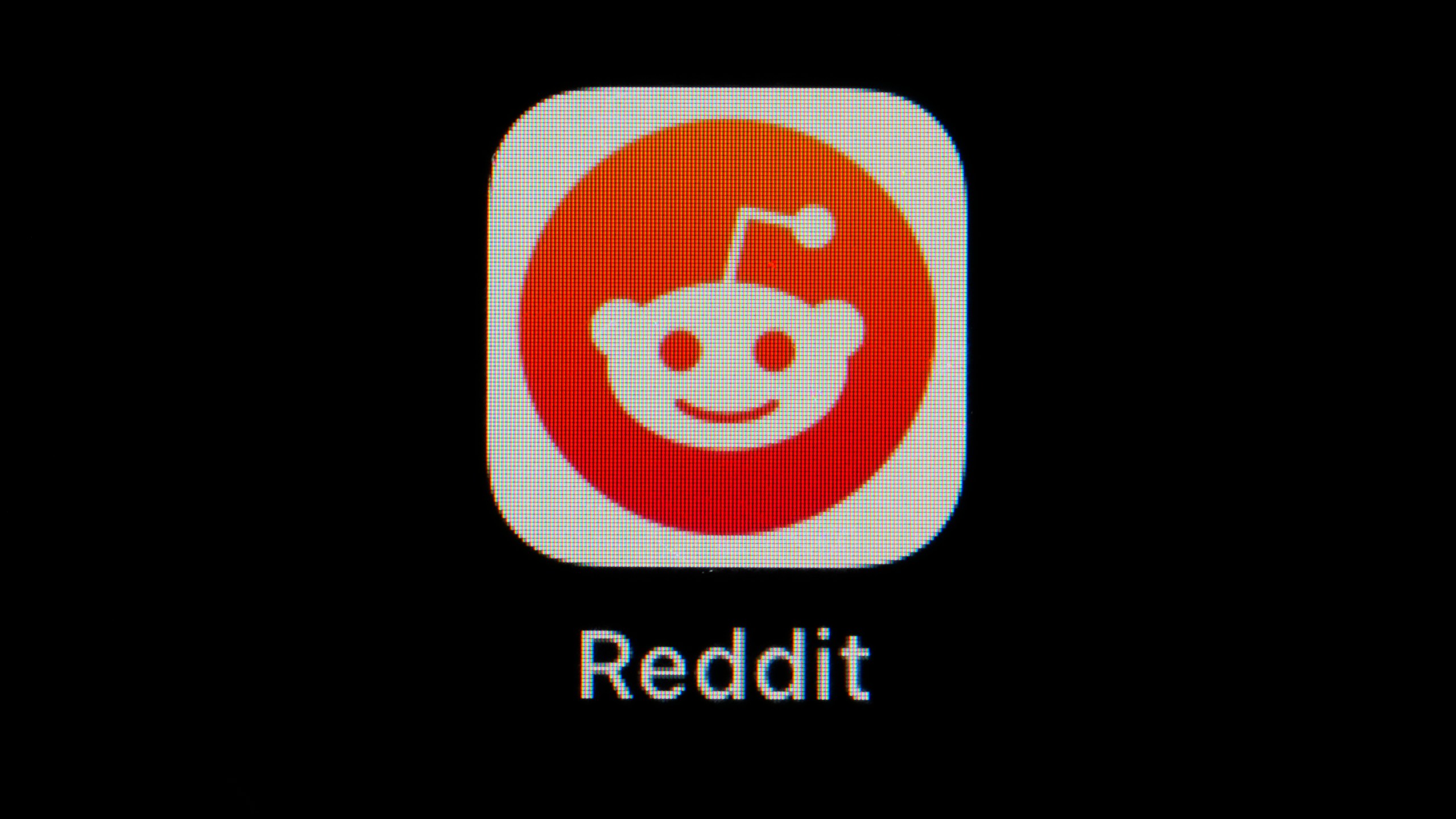 FILE - The Reddit app icon is seen on a smartphone, Feb. 28, 2023, in Marple Township, Pa. Reddit is due to begin trading on the New York Stock Exchange on Tuesday, March 21, 2024. (AP Photo/Matt Slocum, File)