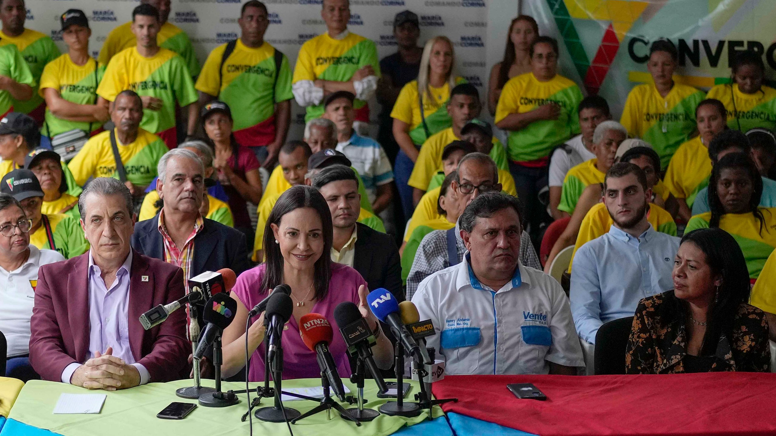 FILE - Opposition presidential hopeful Maria Corina Machado takes part in a press conference accompanied by her national coordinator Henry Alviarez, second from right, and political coordinator Dignora Hernández, right, in Caracas, Venezuela, Sept. 6, 2023. Venezuela's attorney general announced on Wednesday, March 20, 2024 that Alviarez and Hernández were arrested, accused of working in a criminal plot against the government. (AP Photo/Matias Delacroix, File)