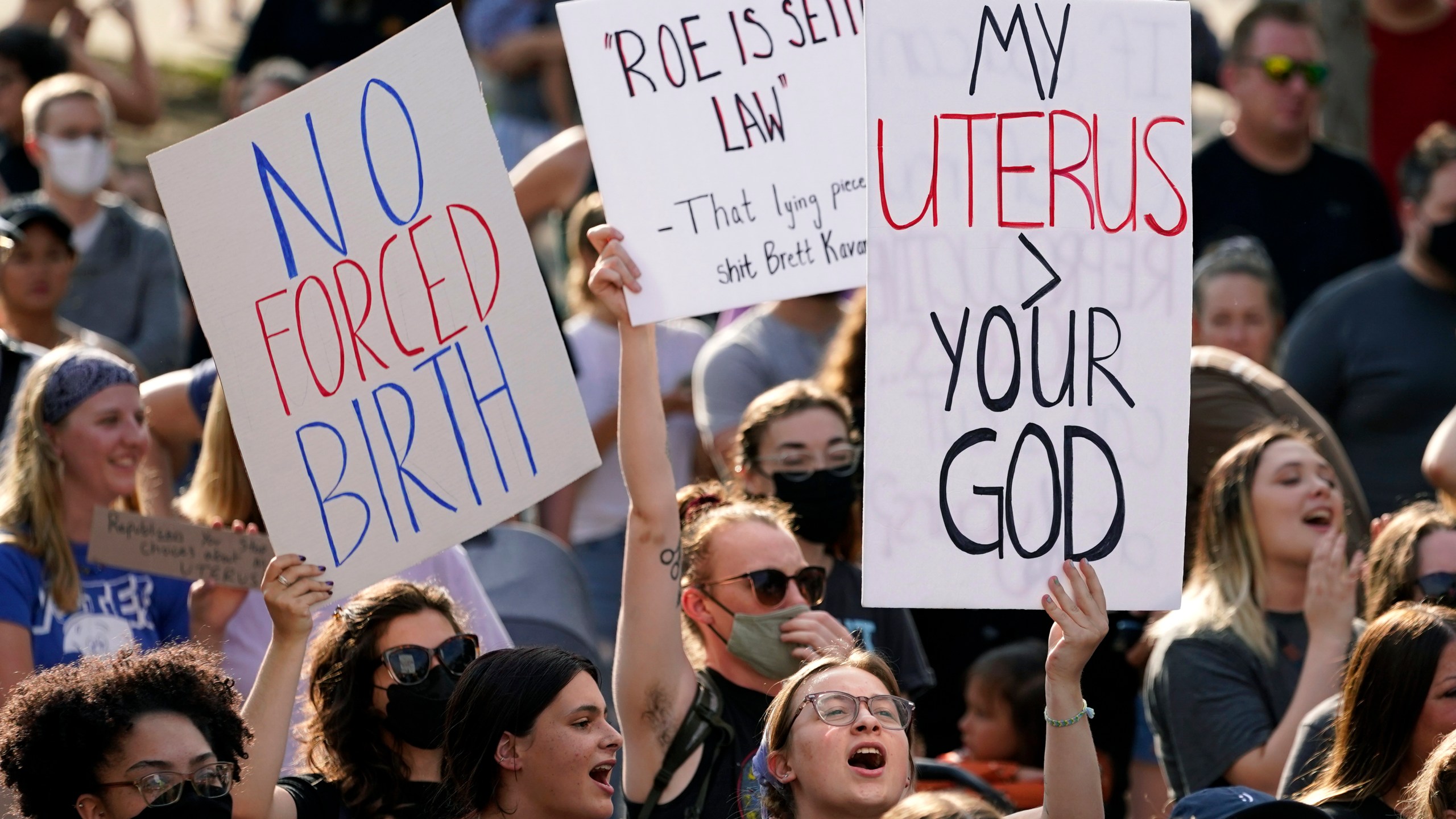 FILE - Abortion-rights protesters cheer at a rally, June 24, 2022, in Des Moines, Iowa. A new poll from from AAPI Data and The Associated Press-NORC Center for Public Affairs Research shows that Asian Americans, Native Hawaiians and Pacific Islanders in the U.S. are highly supportive of legal abortion, even in situations where the pregnant person wants an abortion for any reason. (AP Photo/Charlie Neibergall, File)