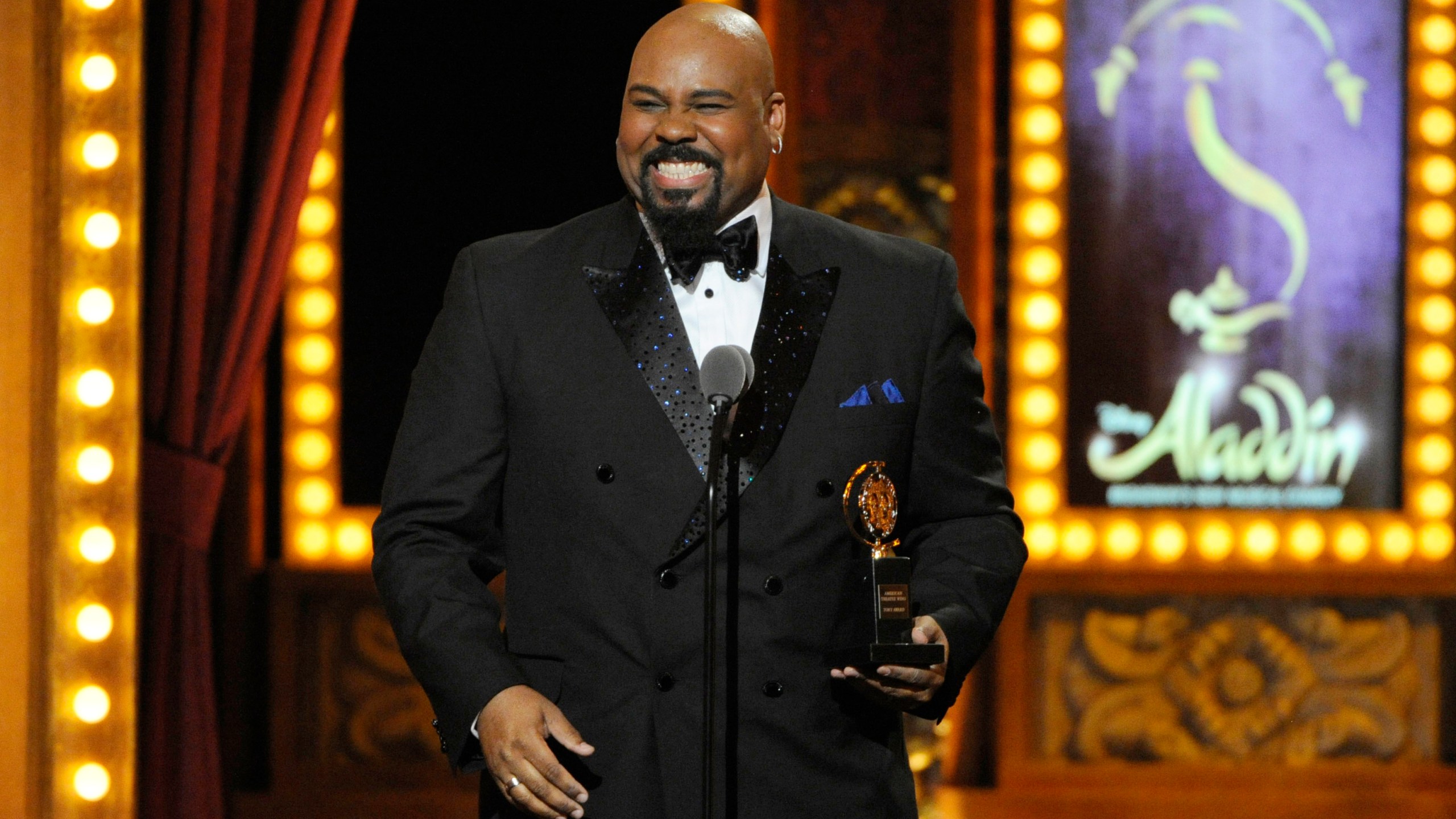 FILE - James Monroe Iglehart accepts the award for best performance by an actor in a featured role in a musical for "Aladdin" on stage at the 68th annual Tony Awards at Radio City Music Hall on Sunday, June 8, 2014, in New York. (Photo by Evan Agostini/Invision/AP, File)
