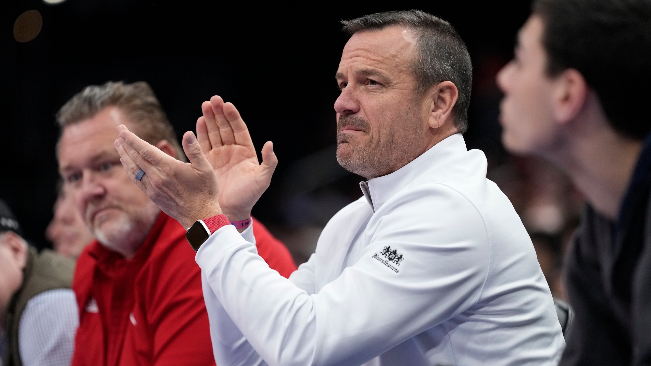 Louisville women's basketball coach Jeff Walz, applauds as he watches Louisville men's team play against North Carolina State during the first half of the Atlantic Coast Conference NCAA college basketball tournament Tuesday, March 12, 2024, in Washington. (AP Photo/Susan Walsh)