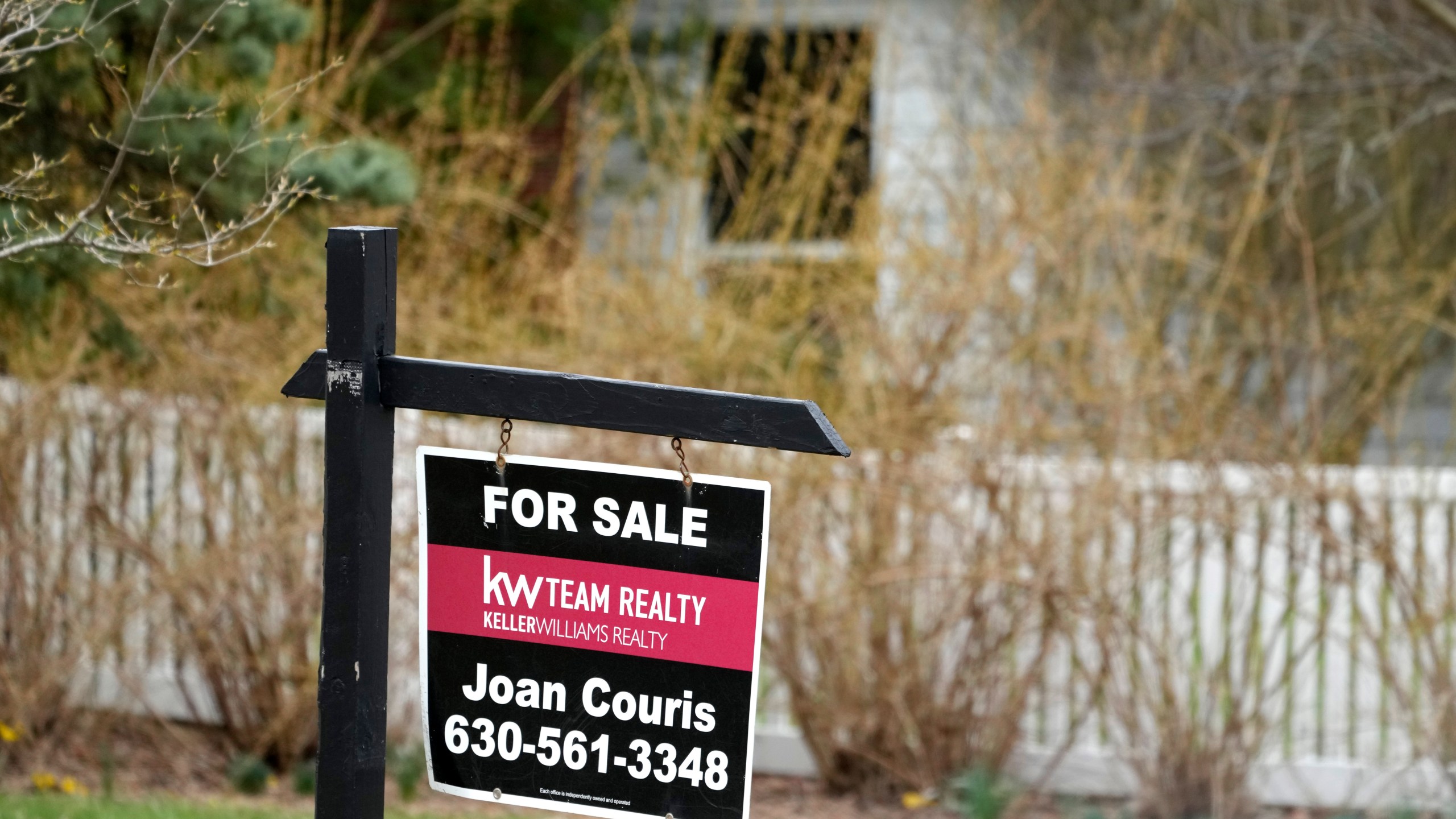 A "for sale" sign is displayed in front of a home in Mount Prospect, Ill., Monday, March 18, 2024. On Thursday, March 21, 2024, the National Association of Realtors reports on existing home sales for February. (AP Photo/Nam Y. Huh)