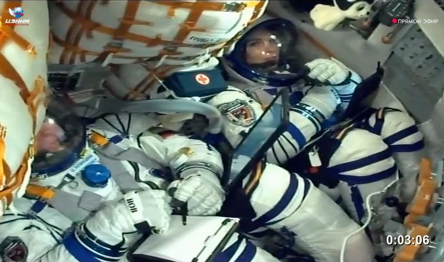 In this photo taken from video released by Roscosmos space corporation, Oleg Novitsky, cosmonaut of Roscosmos and Marina Vasilevskaya, cosmonaut of Belarus sit in the Soyuz MS-25 space ship prior to the cancellation of the launch at the Russian leased Baikonur cosmodrome, Kazakhstan, Thursday, March 21, 2024. Russia's Roscosmos space agency has aborted the launch of three astronauts to the International Space Station about 20 seconds before they were scheduled to lift off. Officials say the crew is safe. The Russian Soyuz rocket was to carry NASA astronaut Tracy Dyson, Oleg Novitsky of Roscosmos and Marina Vasilevskaya of Belarus from the Russia-leased Baikonur launch facility in Kazakhstan. (Roscosmos space corporation via AP)