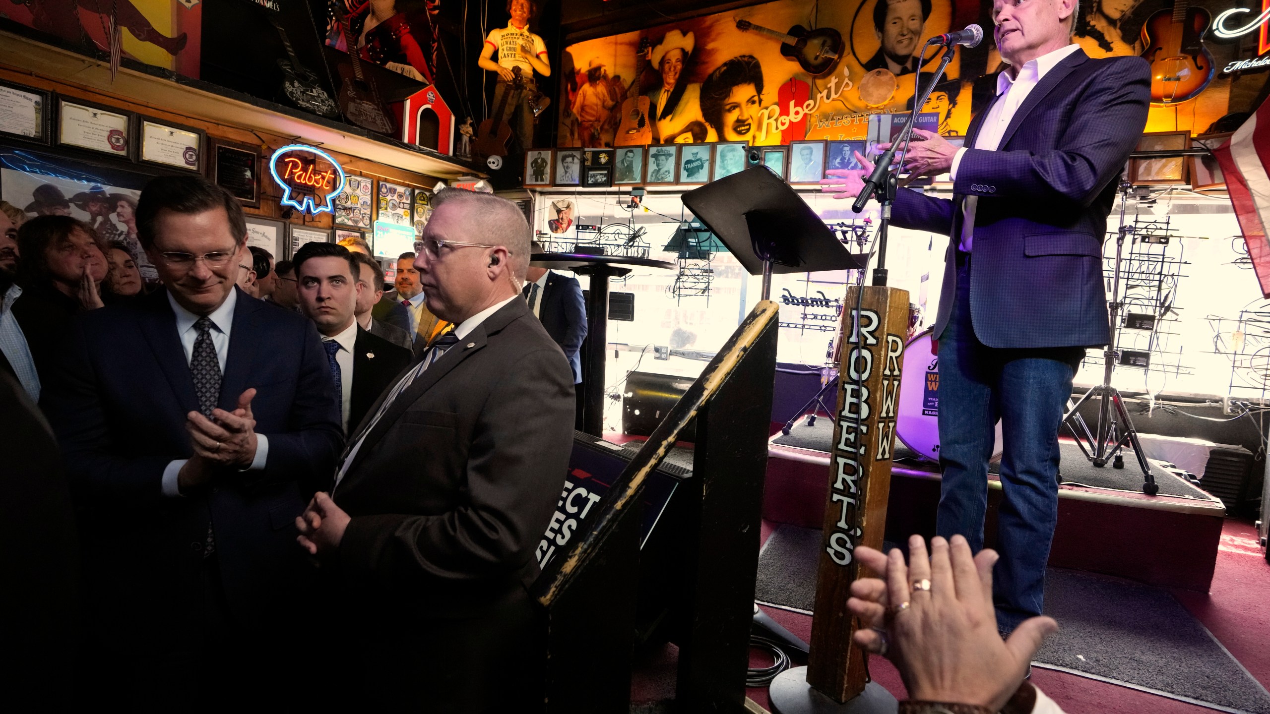 Gov. Bill Lee is applauded as he speaks before signing a bill Thursday, March 21, 2024, in Nashville, Tenn. The legislation is designed to protect songwriters, performers and other music industry professionals against the potential dangers of artificial intelligence. The signing took place in Robert's Western World, an historic honky tonk in downtown Nashville. (AP Photo/Mark Humphrey)