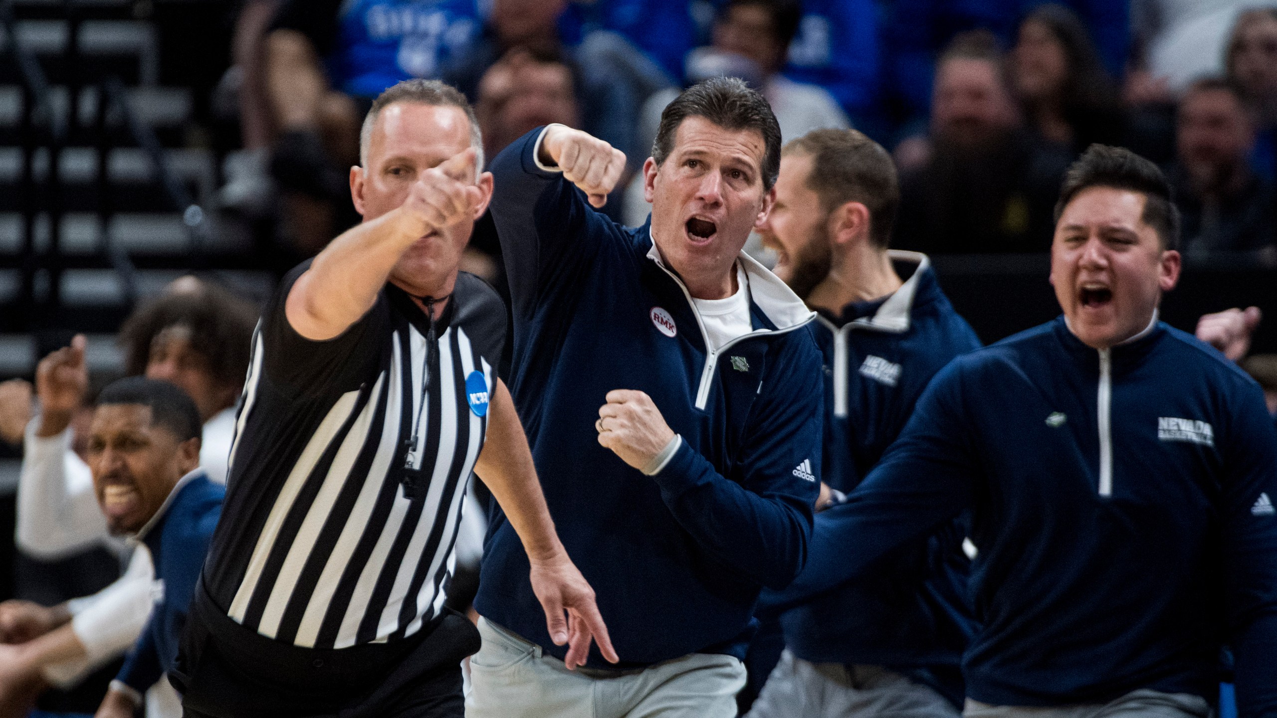 Nevada head coach Steve Alford, center, reacts after a call against Dayton during the first half of a first-round college basketball game in the NCAA Tournament in Salt Lake City, Thursday, March 21, 2024. (AP Photo/Isaac Hale)