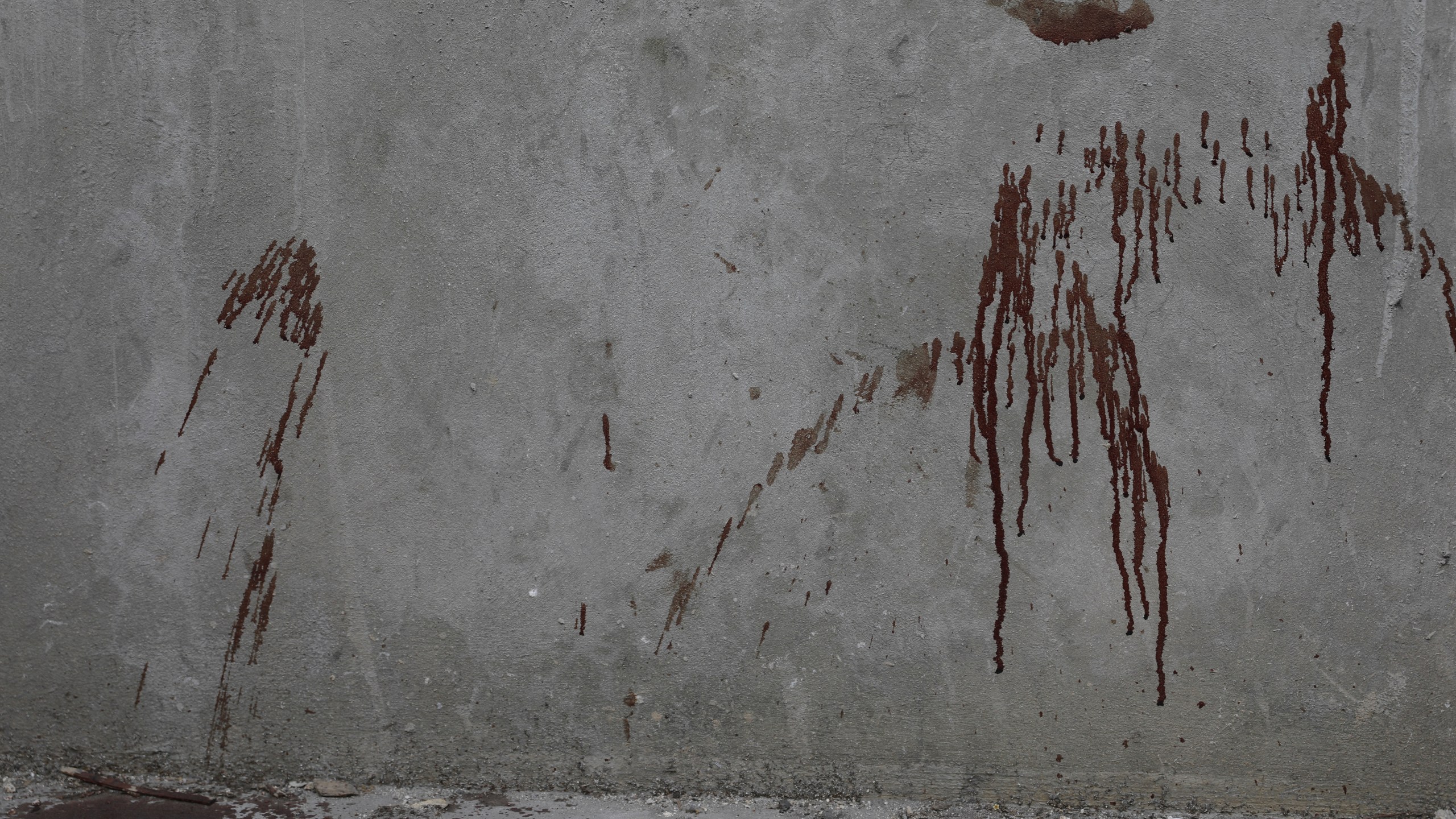 Blood covers a wall in the Petion-ville area of Port-au-Prince, Haiti, Wednesday, March 20, 2024. (AP Photo/Odelyn Joseph)