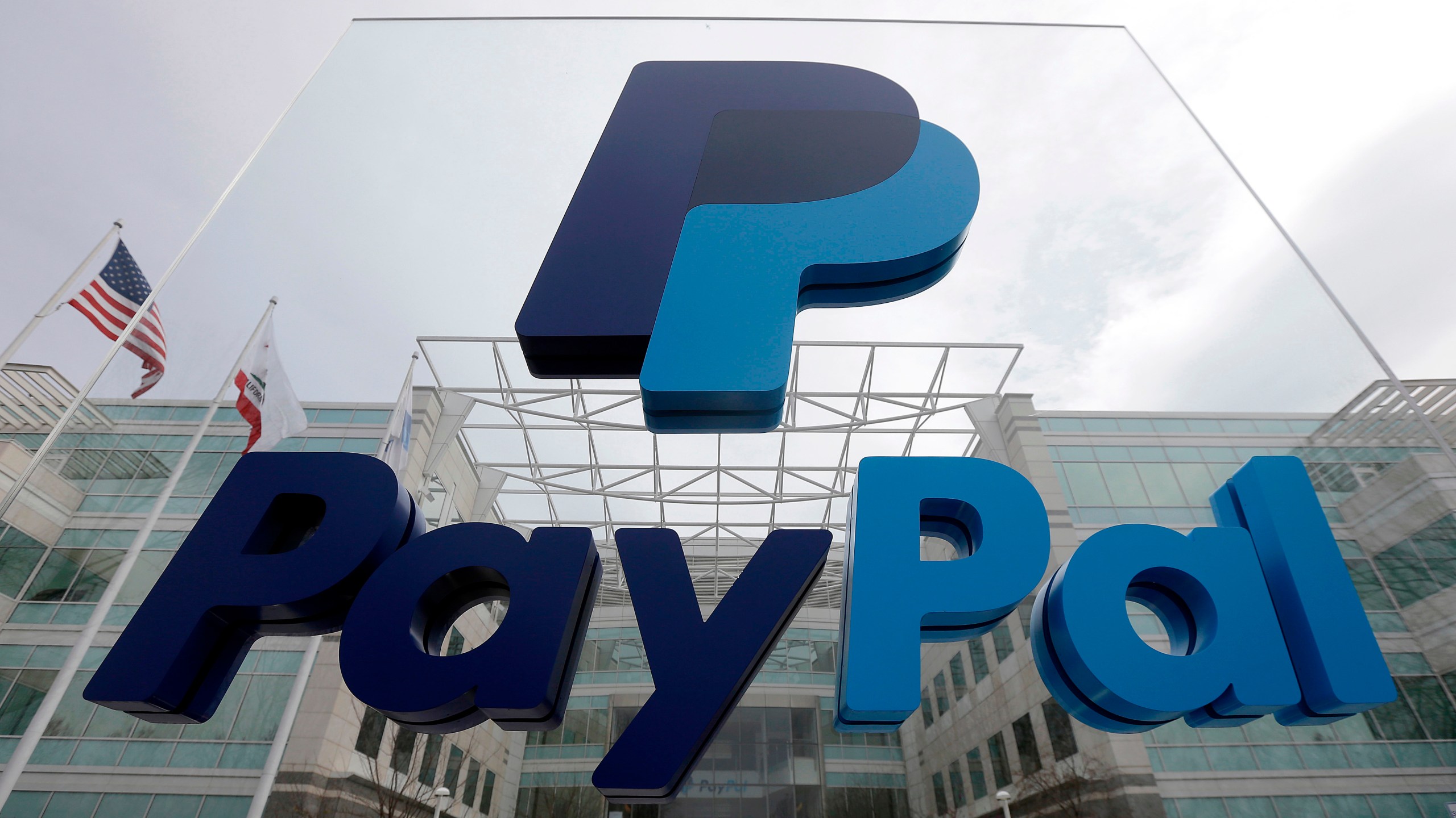 FILE - A PayPal sign is shown in San Jose, Calif., March 10, 2015. Tax reporting requirements for freelancers or gig workers who receive payments via apps like Venmo, Zelle, Cash App or PayPal will change for the 2024 tax year. (AP Photo/Jeff Chiu, File)