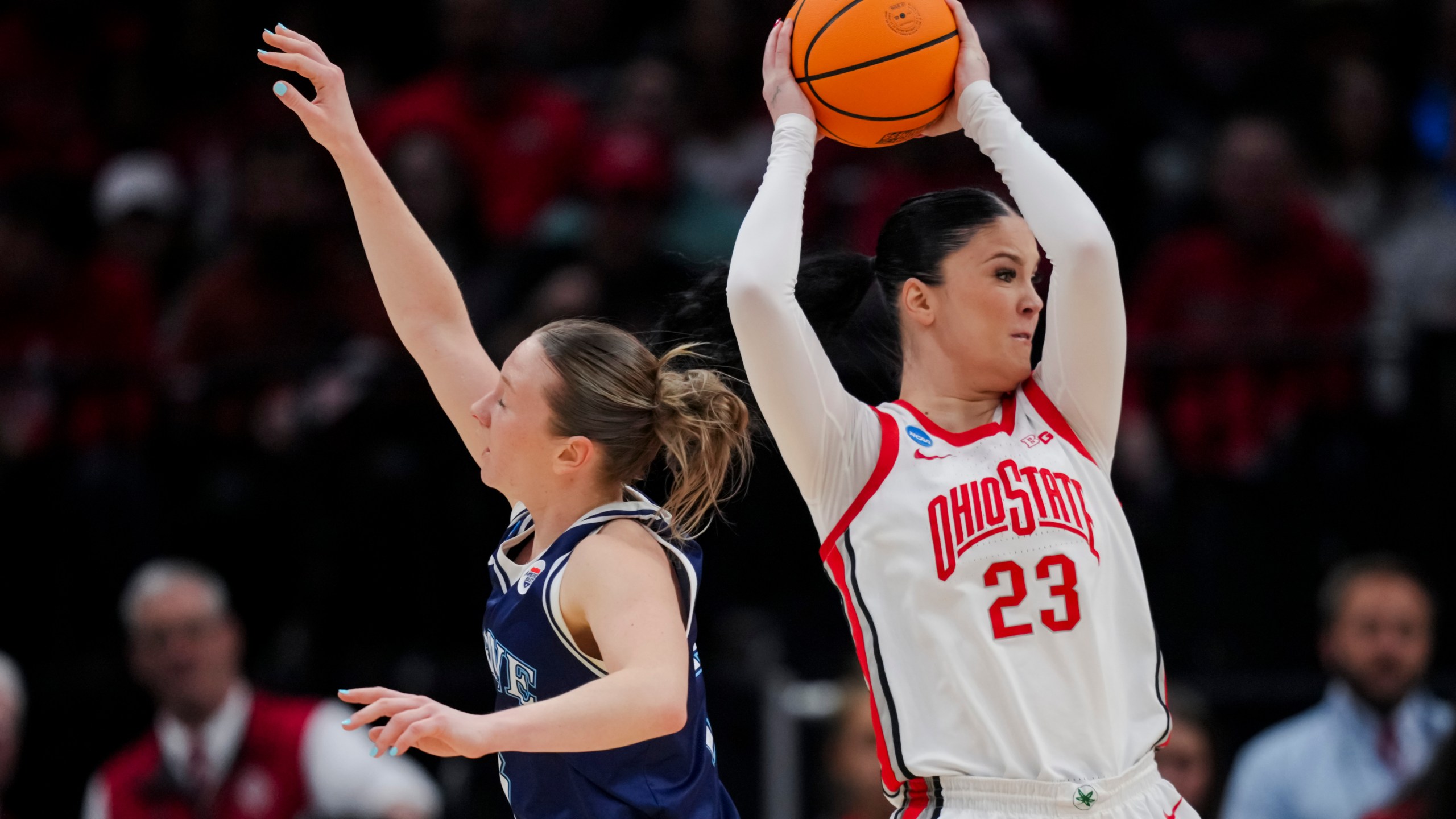 Ohio State forward Rebeka Mikulasikova, right, controls the ball over Maine guard Anne Simon during the first half of a first-round college basketball game in the women's NCAA Tournament, Friday, March 22, 2024, in Columbus, Ohio. (AP Photo/Aaron Doster)