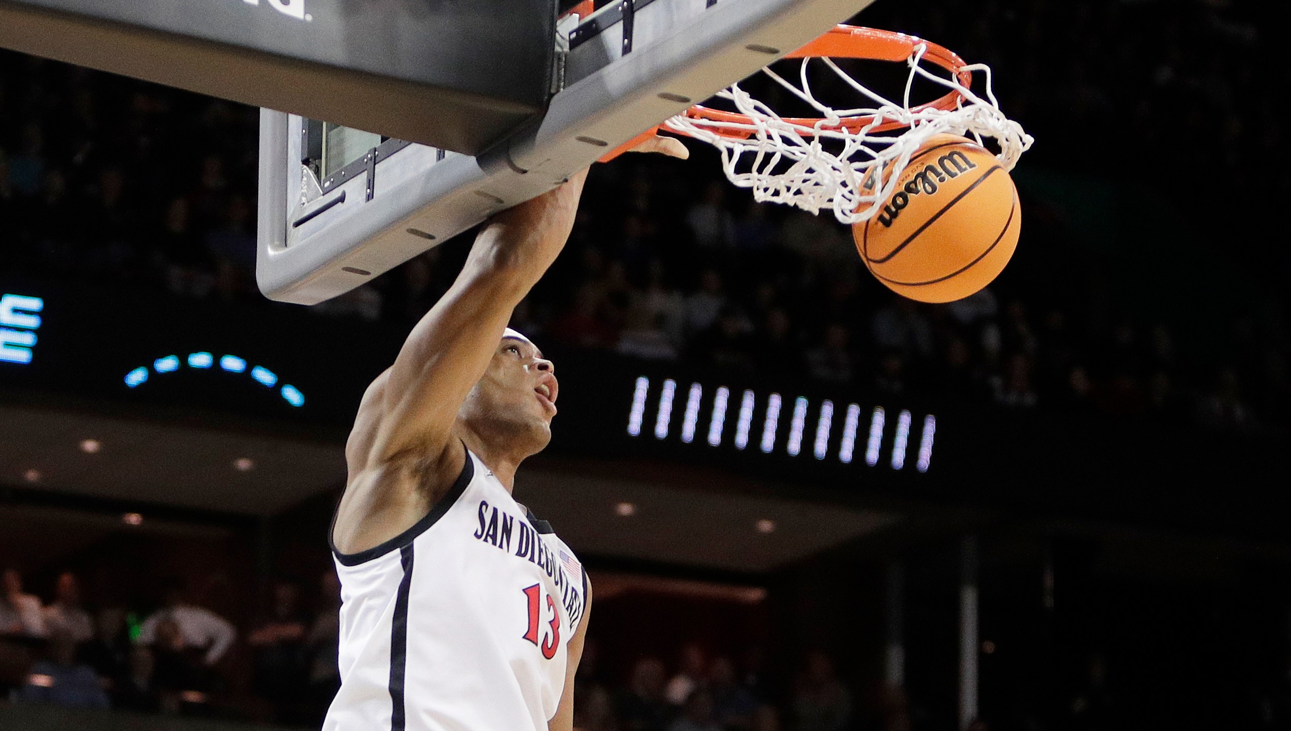 San Diego State forward Jaedon LeDee (13) dunks during the first half of a first-round college basketball game in the NCAA Tournament against UAB in Spokane, Wash., Friday, March 22, 2024. (AP Photo/Young Kwak)