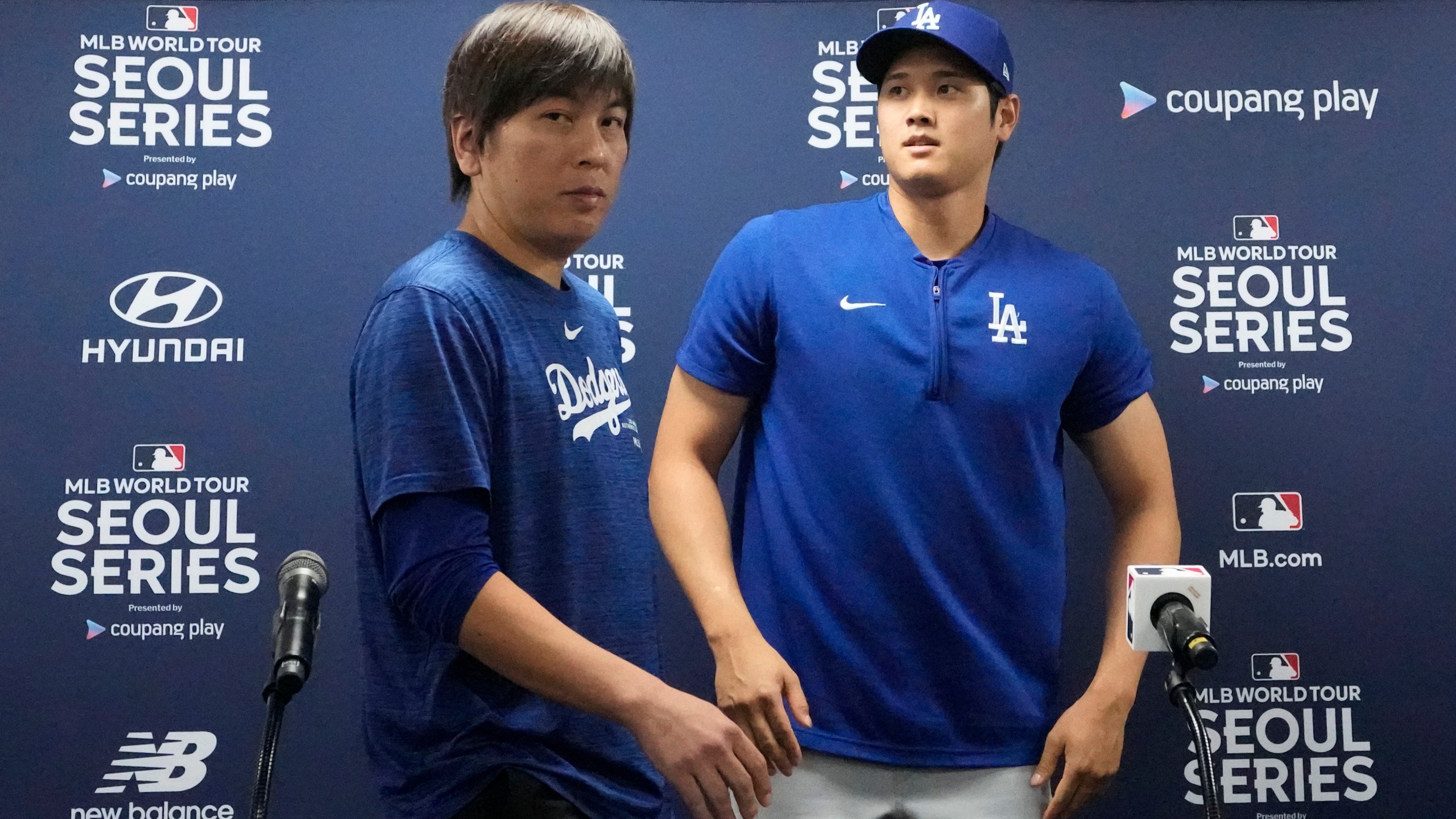 Los Angeles Dodgers' Shohei Ohtani, right, and his interpreter, Ippei Mizuhara, leave after at a news conference ahead of a baseball workout at Gocheok Sky Dome in Seoul, South Korea, Saturday, March 16, 2024. Ohtani’s interpreter and close friend has been fired by the Dodgers following allegations of illegal gambling and theft from the Japanese baseball star. (AP Photo/Lee Jin-man)