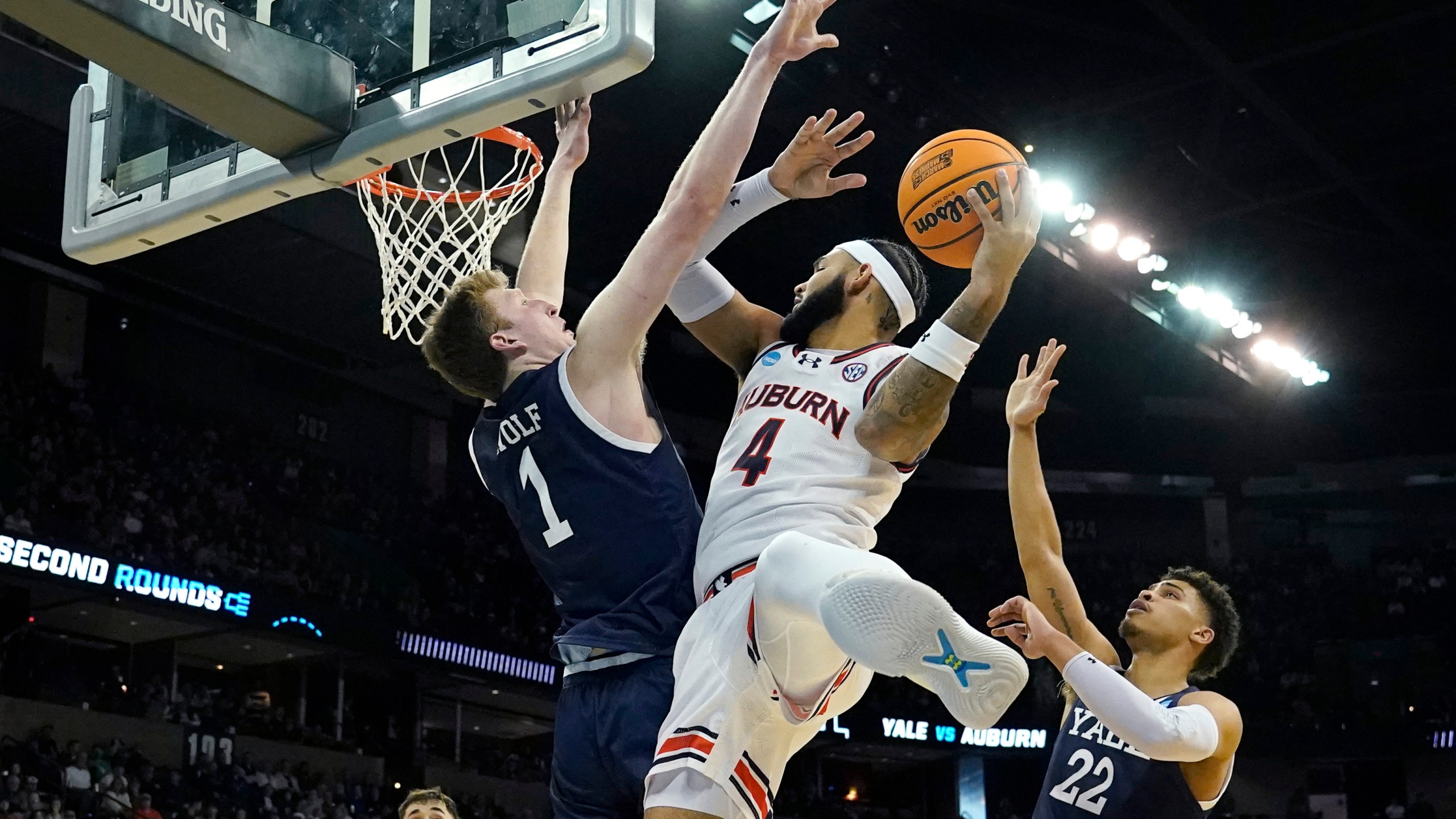 Auburn forward Jay Pal (4) puts up a shot as Yale forward Danny Wolf (1) defends during the first half of a first-round college basketball game in the NCAA Tournament in Spokane, Wash., Friday, March 22, 2024. (AP Photo/Ted S. Warren)