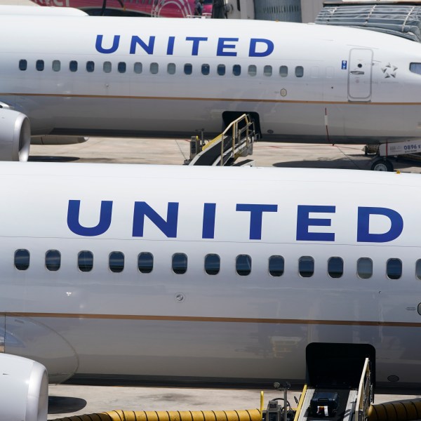 FILE - Two United Airlines Boeing 737s are parked at the gate at the Fort Lauderdale-Hollywood International Airport in Fort Lauderdale, Fla., July 7, 2022. United Airlines said Friday, March 22, 2024, that federal regulators are increasing their oversight of the carrier following a series of recent incidents including a piece of the outer fuselage falling off one jet and another suffering an engine fire on takeoff. (AP Photo/Wilfredo Lee, File)