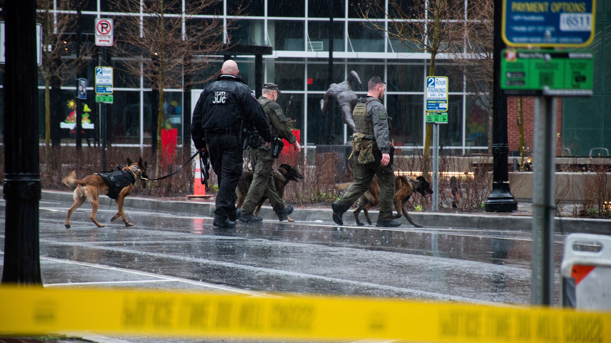 Police K-9s patrol around the cordoned off 100 block of Queen Street in Lancaster, Pa., Saturday, March 23, 2024. A "Drag Queen Story Hour," at the Lancaster Public Library was canceled after police responded to a suspicious package. (Amber Ritson/LNP/LancasterOnline via AP)