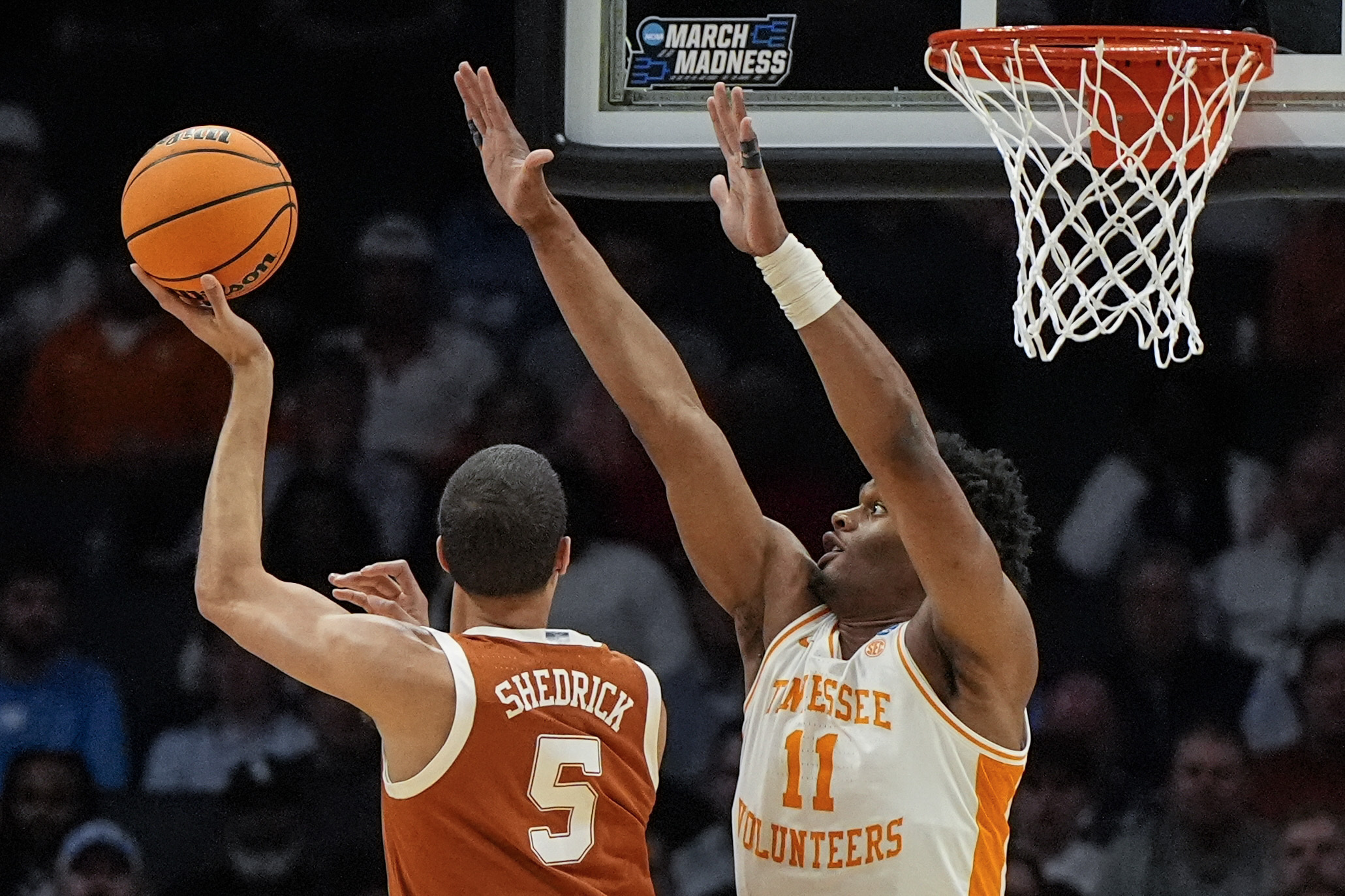 Texas forward Kadin Shedrick (5) shoots against Tennessee forward Tobe Awaka (11) during the first half of a second-round college basketball game in the NCAA Tournament, Saturday, March 23, 2024, in Charlotte, N.C. (AP Photo/Mike Stewart)