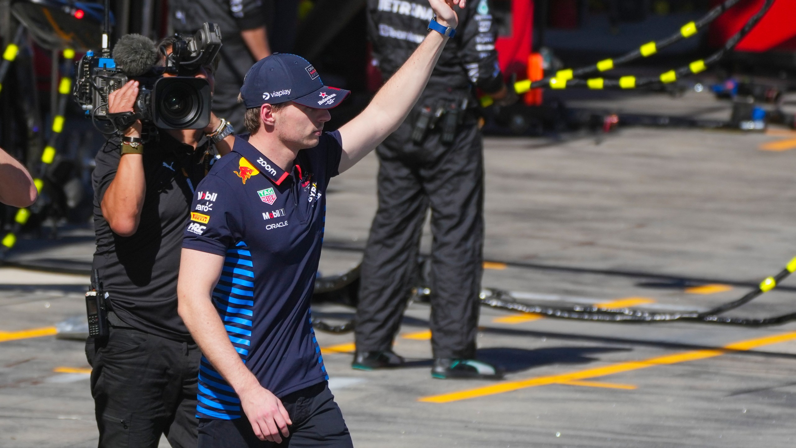 Red Bull driver Max Verstappen of the Netherlands gestures to fans after retiring from the Australian Formula One Grand Prix at Albert Park, in Melbourne, Australia, Sunday, March 24, 2024. (AP Photo/Scott Barbour,Pool)