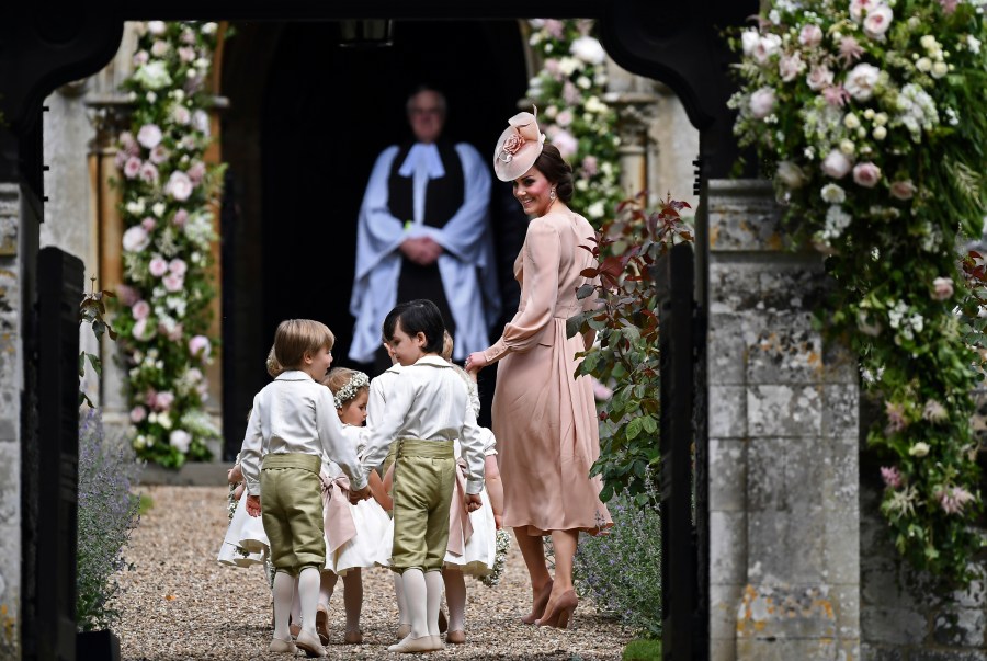 Britain's Catherine, Duchess of Cambridge, right, walks with the bridesmaids and pageboys as they arrive for her sister Pippa Middleton's wedding to James Matthews, at St Mark's Church in Englefield, England, Saturday, May 20, 2017. (Justin Tallis/Pool Photo via AP, File)