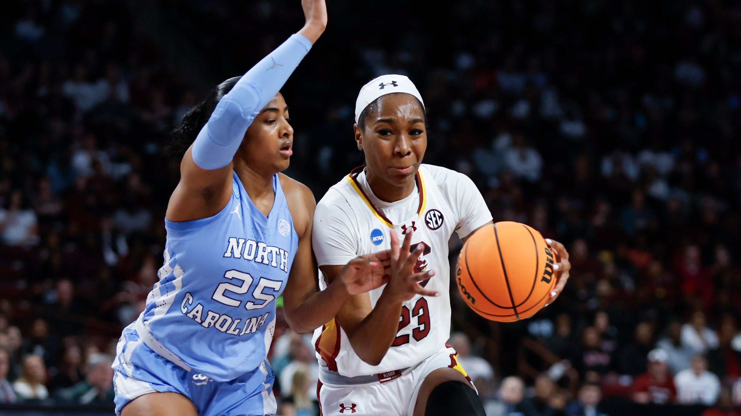 South Carolina guard Bree Hall, right, drives against North Carolina guard Deja Kelly, left, during the first half of a second-round college basketball game in the women's NCAA Tournament in Columbia, S.C., Sunday, March 24, 2024. (AP Photo/Nell Redmond)
