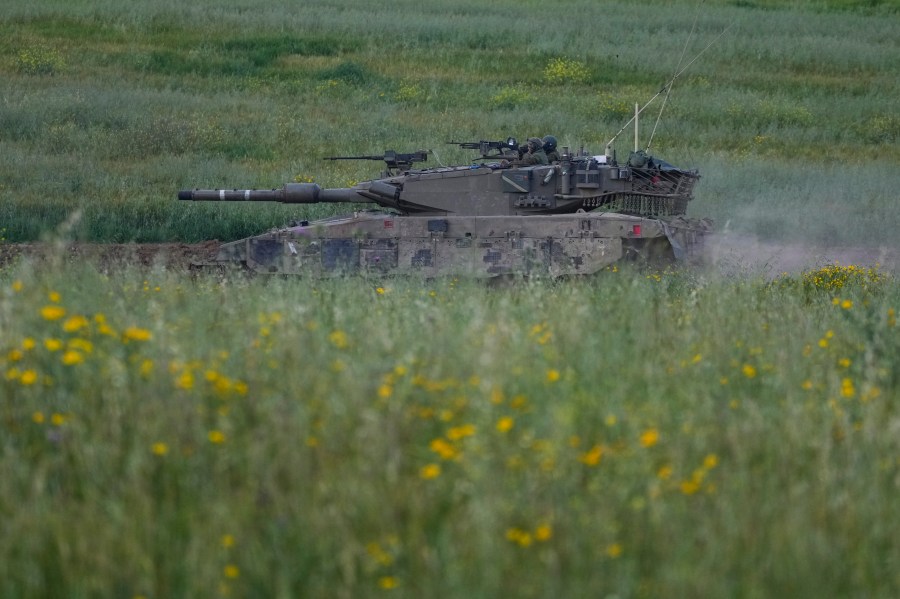 Israeli soldiers drive a tank in southern Israel, near the border with the Gaza Strip, Sunday, March 24, 2024. (AP Photo/Tsafrir Abayov)