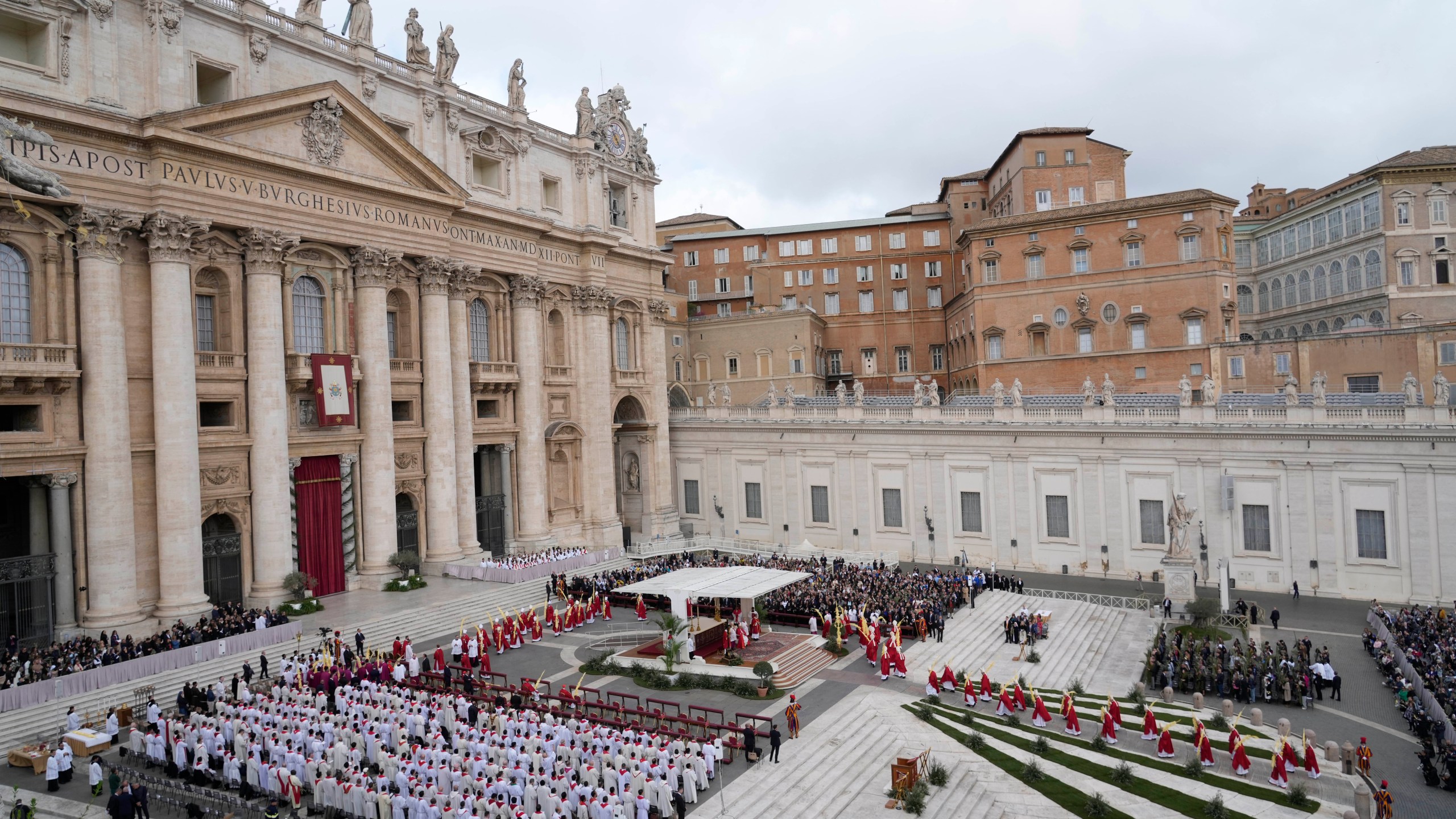 Faithful gather in St. Peter's Square on the occasion of the Palm Sunday mass at the Vatican, Sunday, March 24, 2024. (AP Photo/Gregorio Borgia)