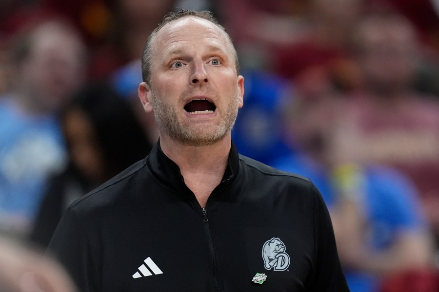 Drake head coach Darian DeVries yells from the sidelines during the first half of a first-round college basketball game against Washington State in the NCAA Tournament Thursday, March 21, 2024, in Omaha, Neb. (AP Photo/Charlie Neibergall)