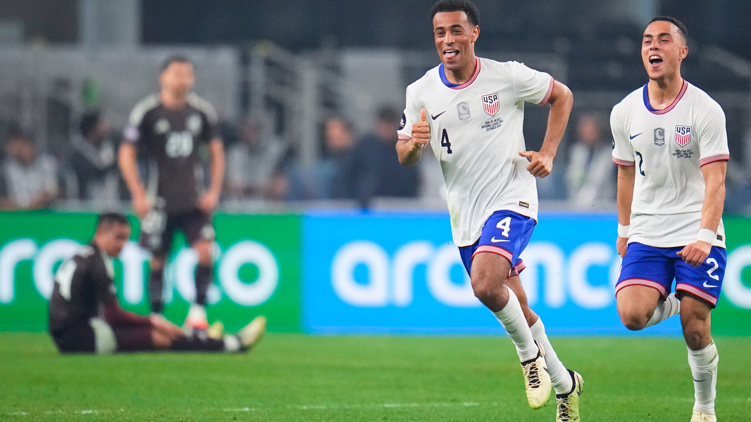 United States midfielder Tyler Adams (4) celebrates his goal with defender Sergino Dest during the first half of a CONCACAF Nations League final soccer match against Mexico, Sunday, March 24, 2024, in Arlington, Texas. (AP Photo/Julio Cortez)