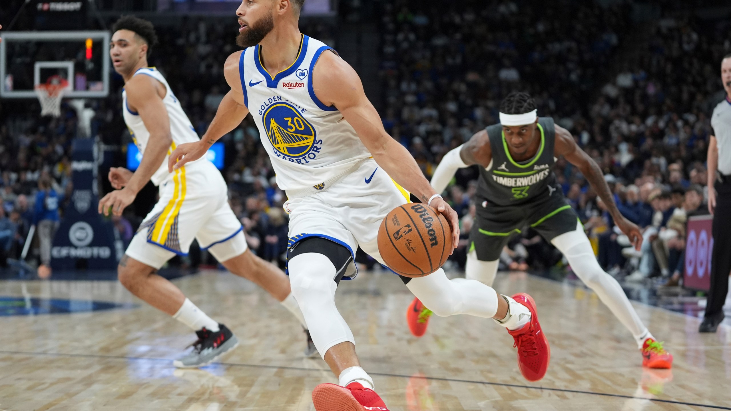 Golden State Warriors guard Stephen Curry (30) works toward the basket during the first half of an NBA basketball game against the Minnesota Timberwolves, Sunday, March 24, 2024, in Minneapolis. (AP Photo/Abbie Parr)